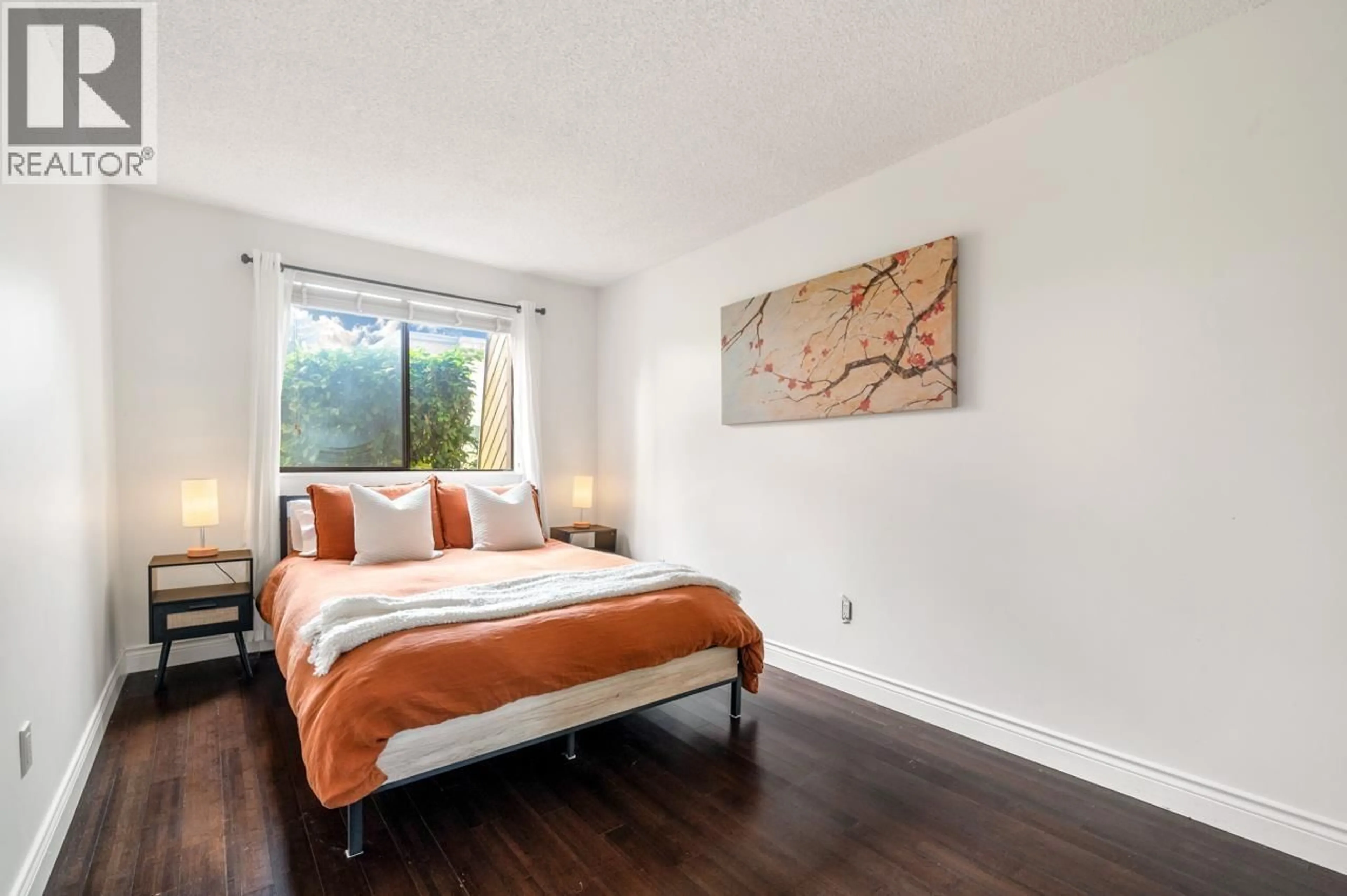 Bedroom with bed, wood/laminate floor for 119 - 3911 CARRIGAN COURT, Burnaby British Columbia V3N4J7