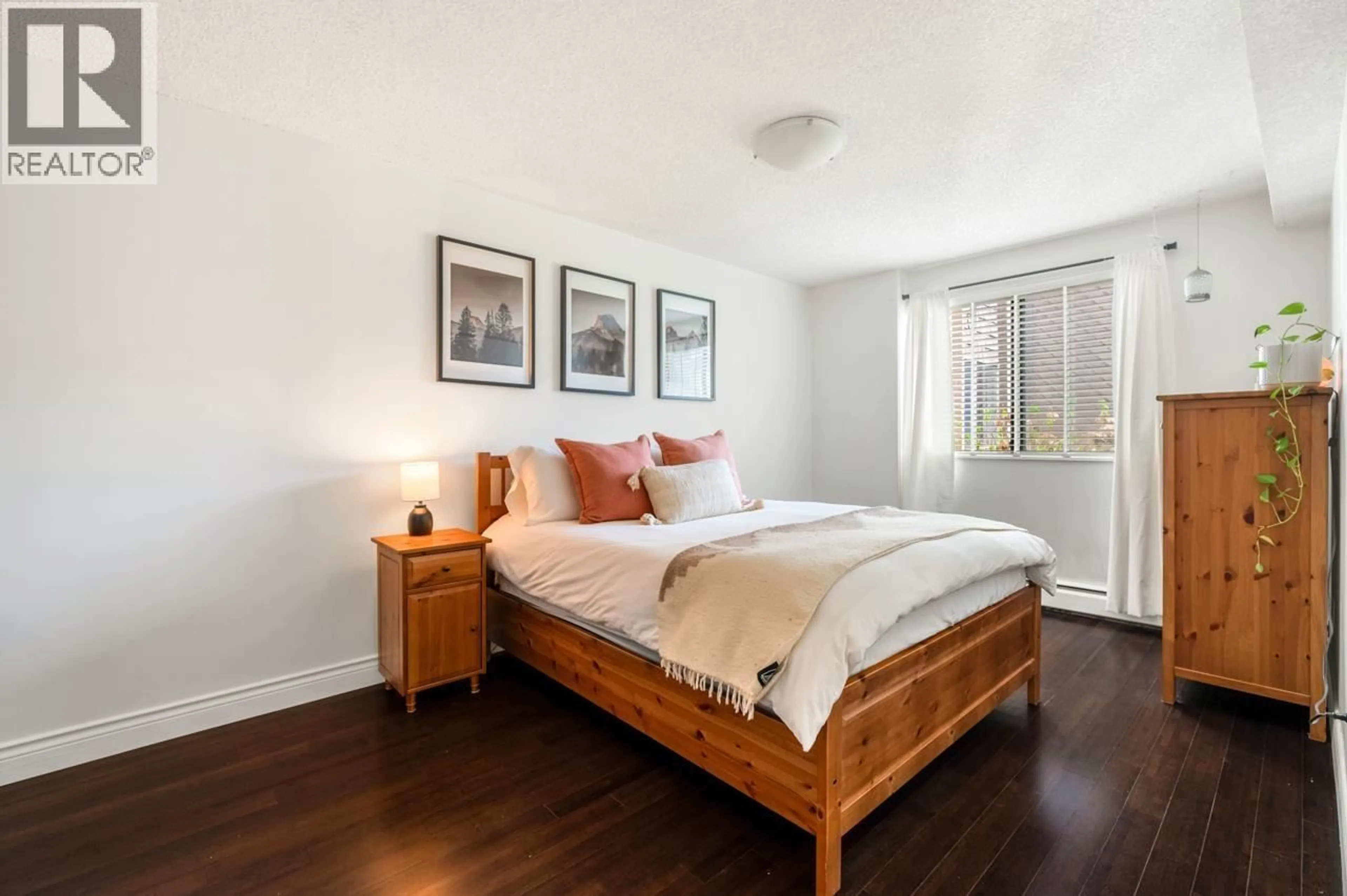 Bedroom with bed, wood/laminate floor for 119 - 3911 CARRIGAN COURT, Burnaby British Columbia V3N4J7
