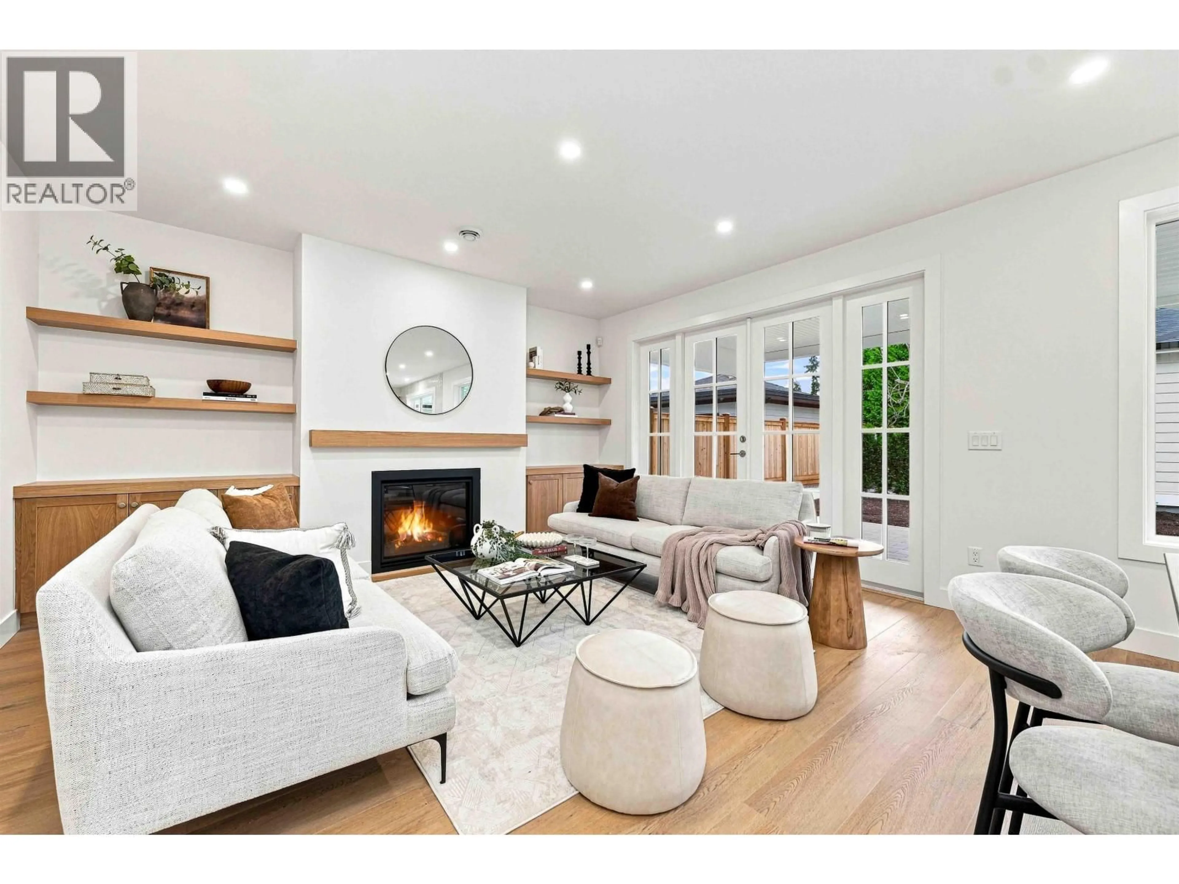 Living room with furniture, wood/laminate floor for 5841 48A AVENUE, Ladner British Columbia V4K1Y5
