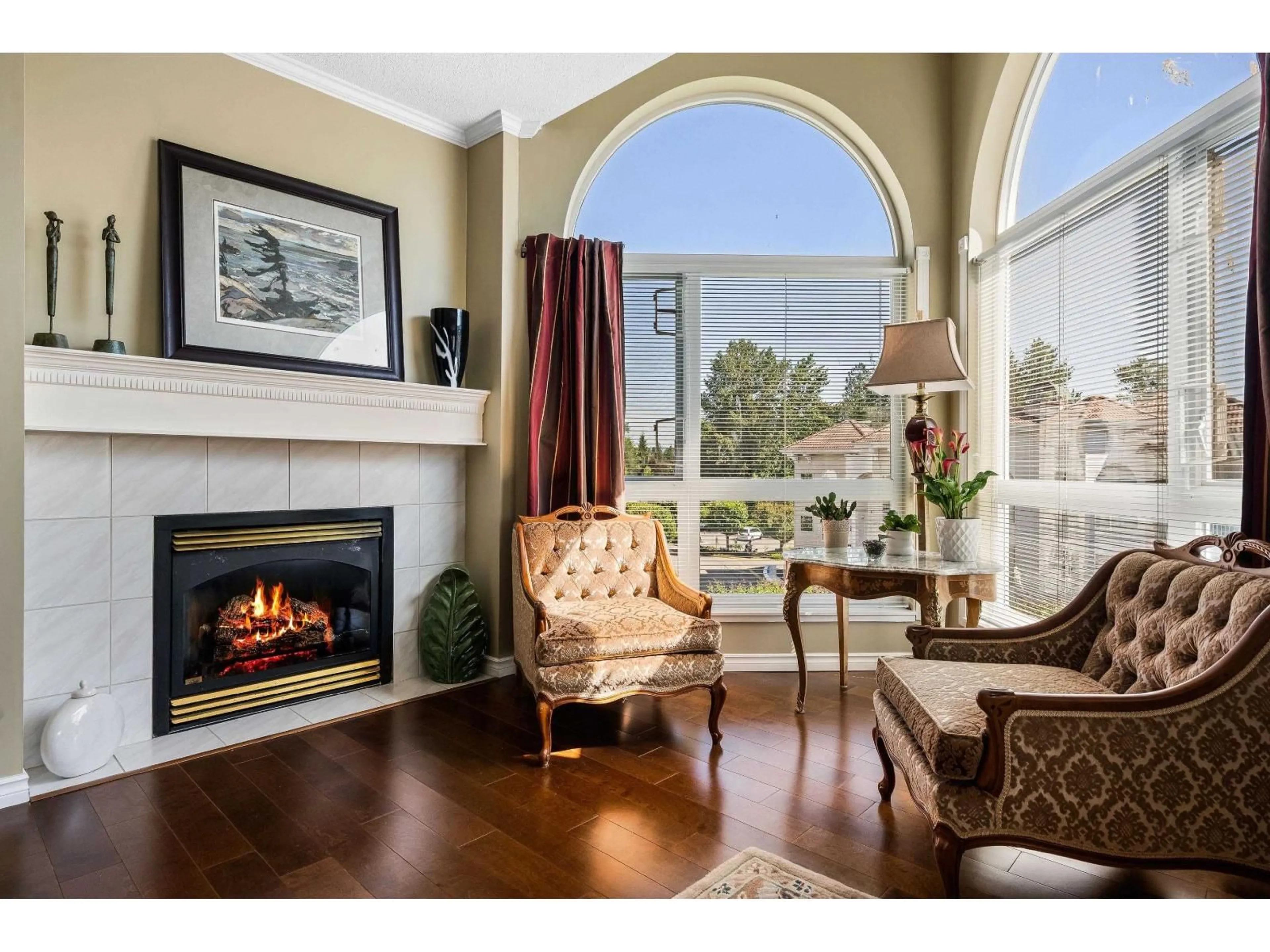 Living room with furniture, wood/laminate floor for 402 - 3172 GLADWIN ROAD, Abbotsford British Columbia V2T5T3