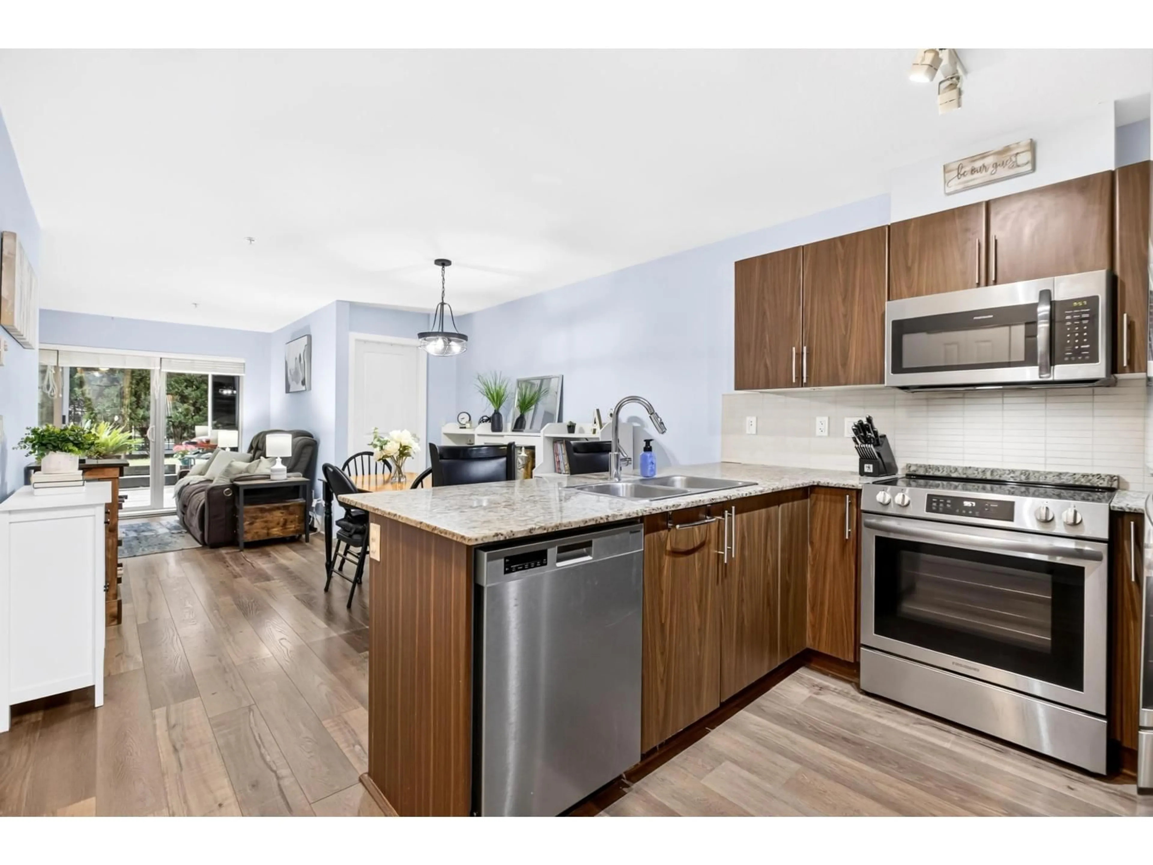 Open concept kitchen, wood/laminate floor for A108 - 8929 202 STREET, Langley British Columbia V1M0B4