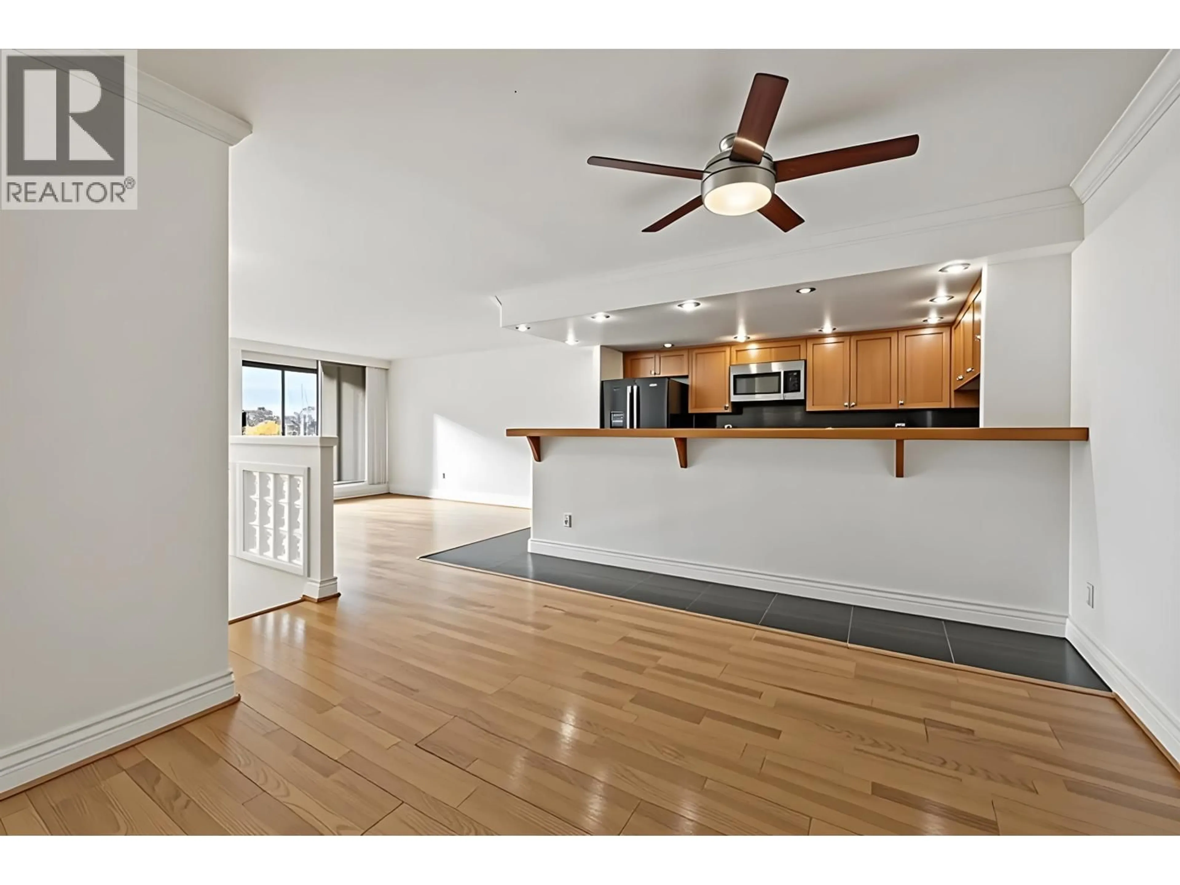 Open concept kitchen, wood/laminate floor for 205 - 1600 HOWE STREET, Vancouver British Columbia V6Z2L9