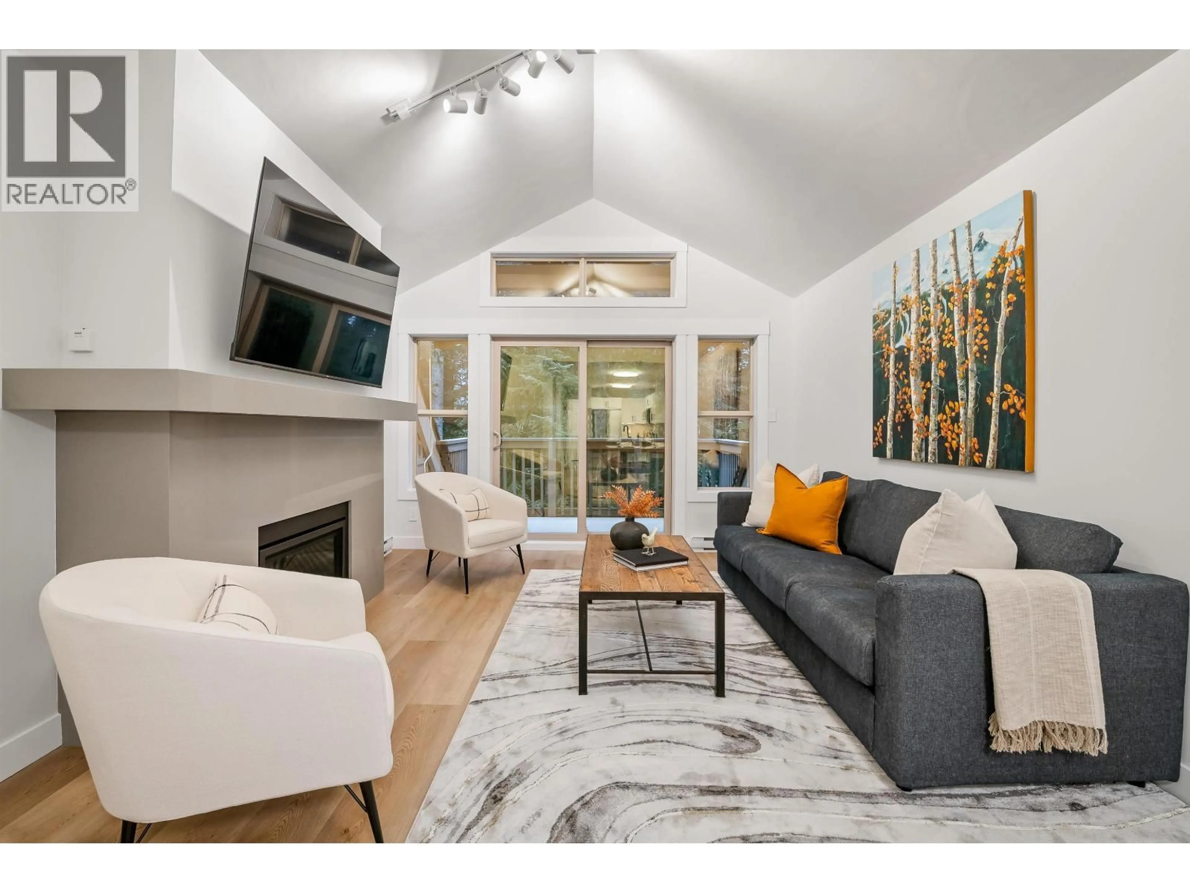 Living room with furniture, wood/laminate floor for 21 - 4890 PAINTED CLIFF ROAD, Whistler British Columbia V8E1C9