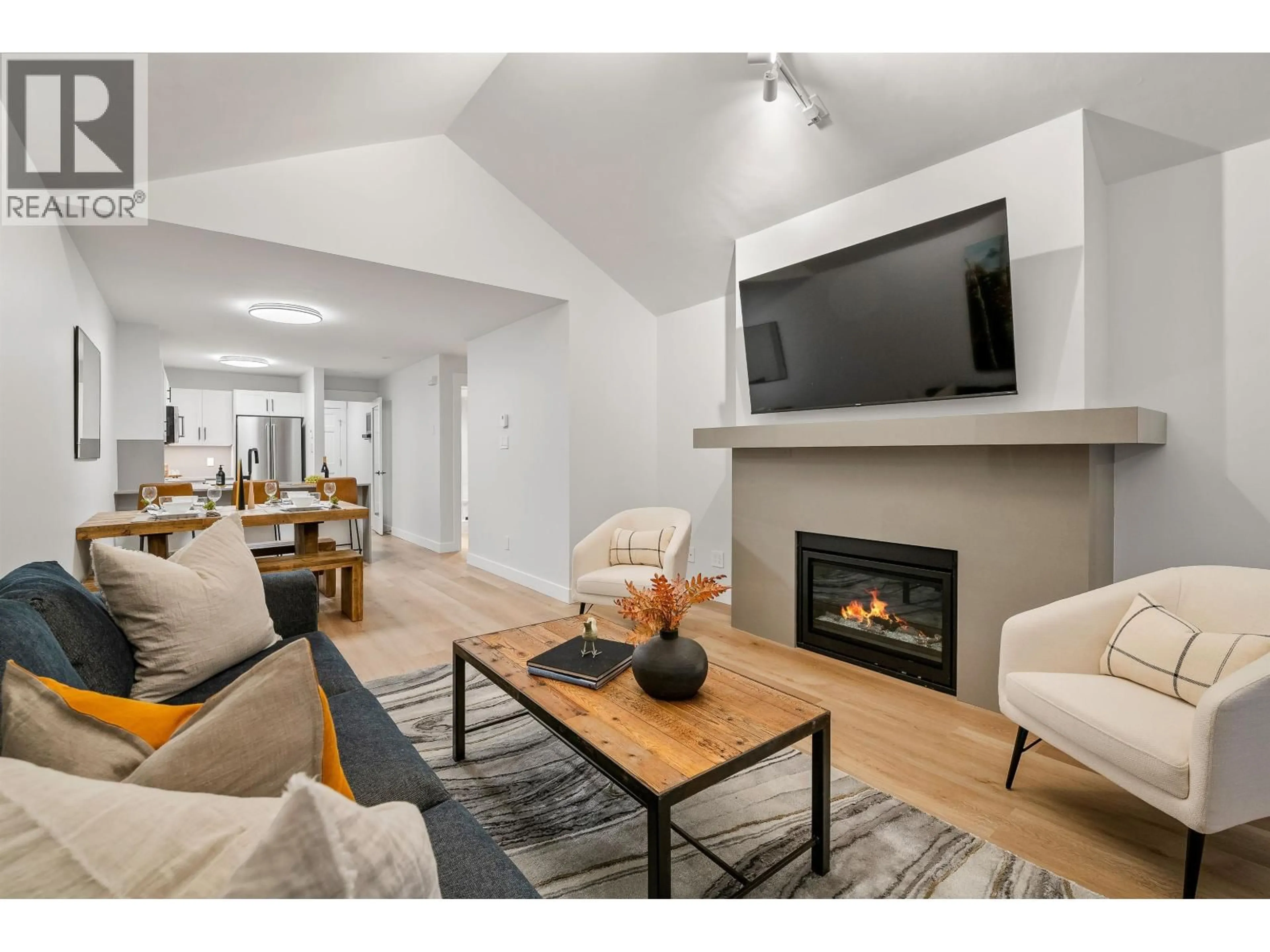 Living room with furniture, wood/laminate floor for 21 - 4890 PAINTED CLIFF ROAD, Whistler British Columbia V8E1C9