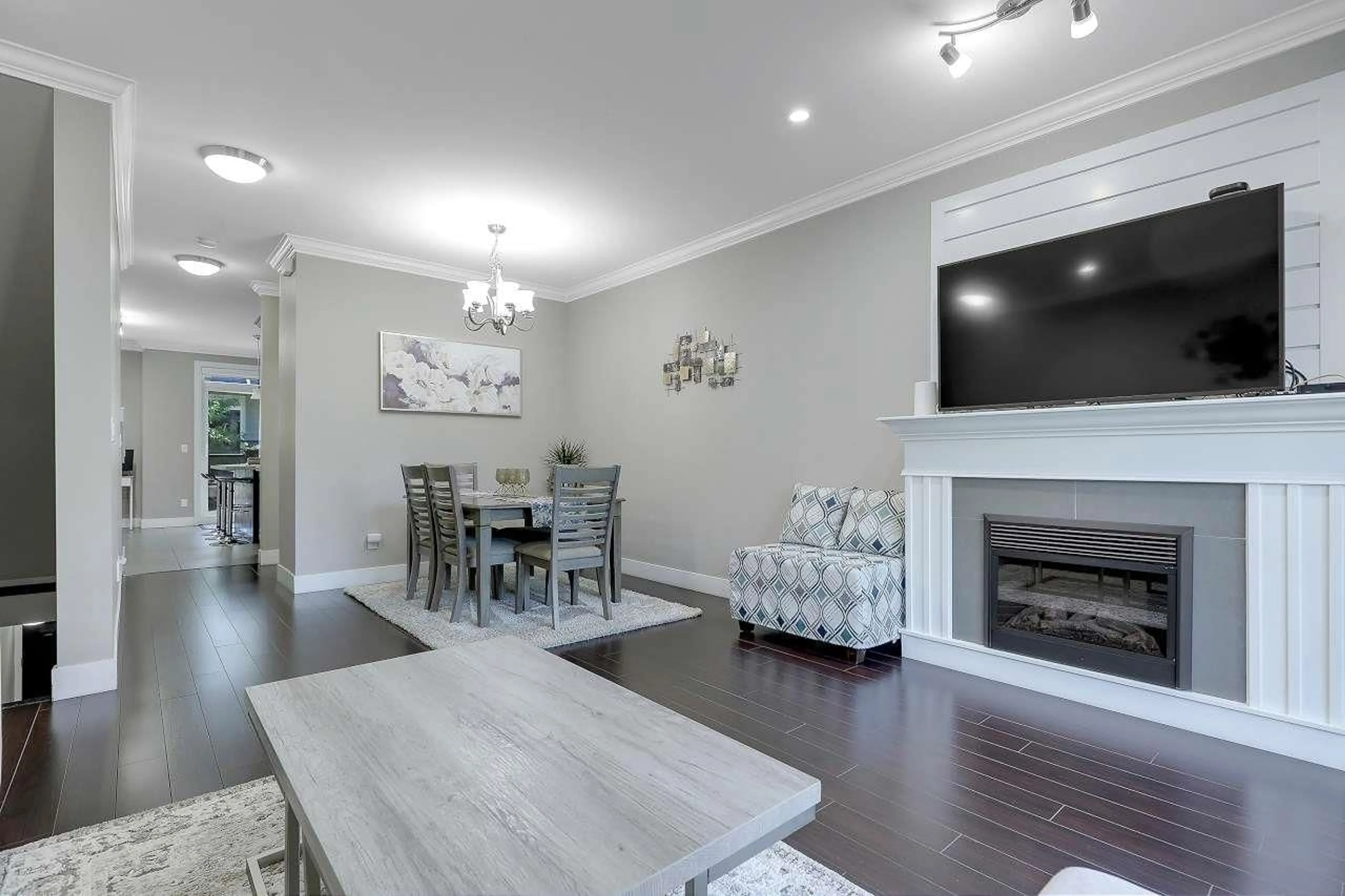 Living room with furniture, wood/laminate floor for 50 - 6383 140 STREET, Surrey British Columbia V3W0E9