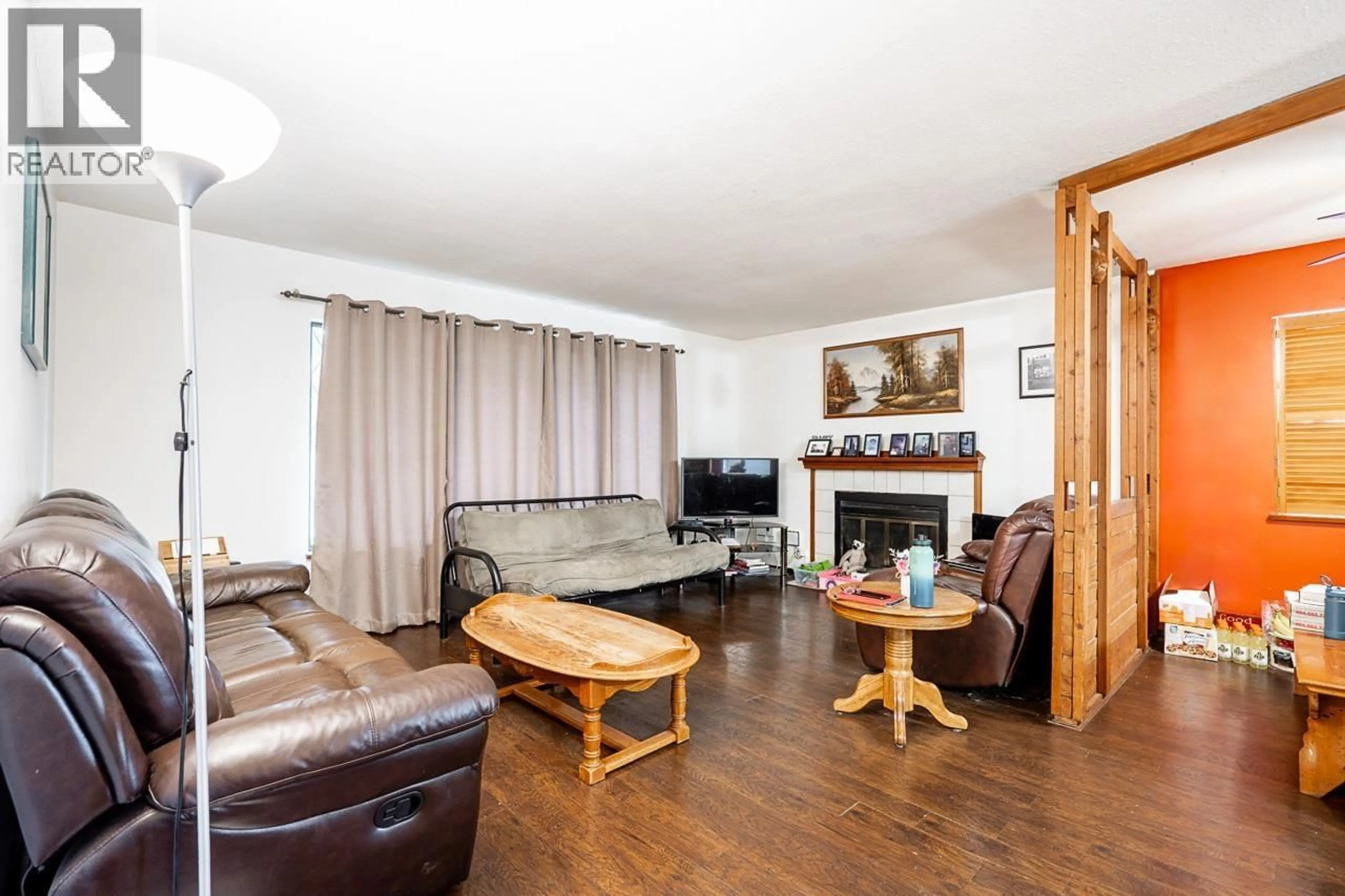 Living room with furniture, wood/laminate floor for 1828 PRAIRIE AVENUE, Port Coquitlam British Columbia V3B1V3