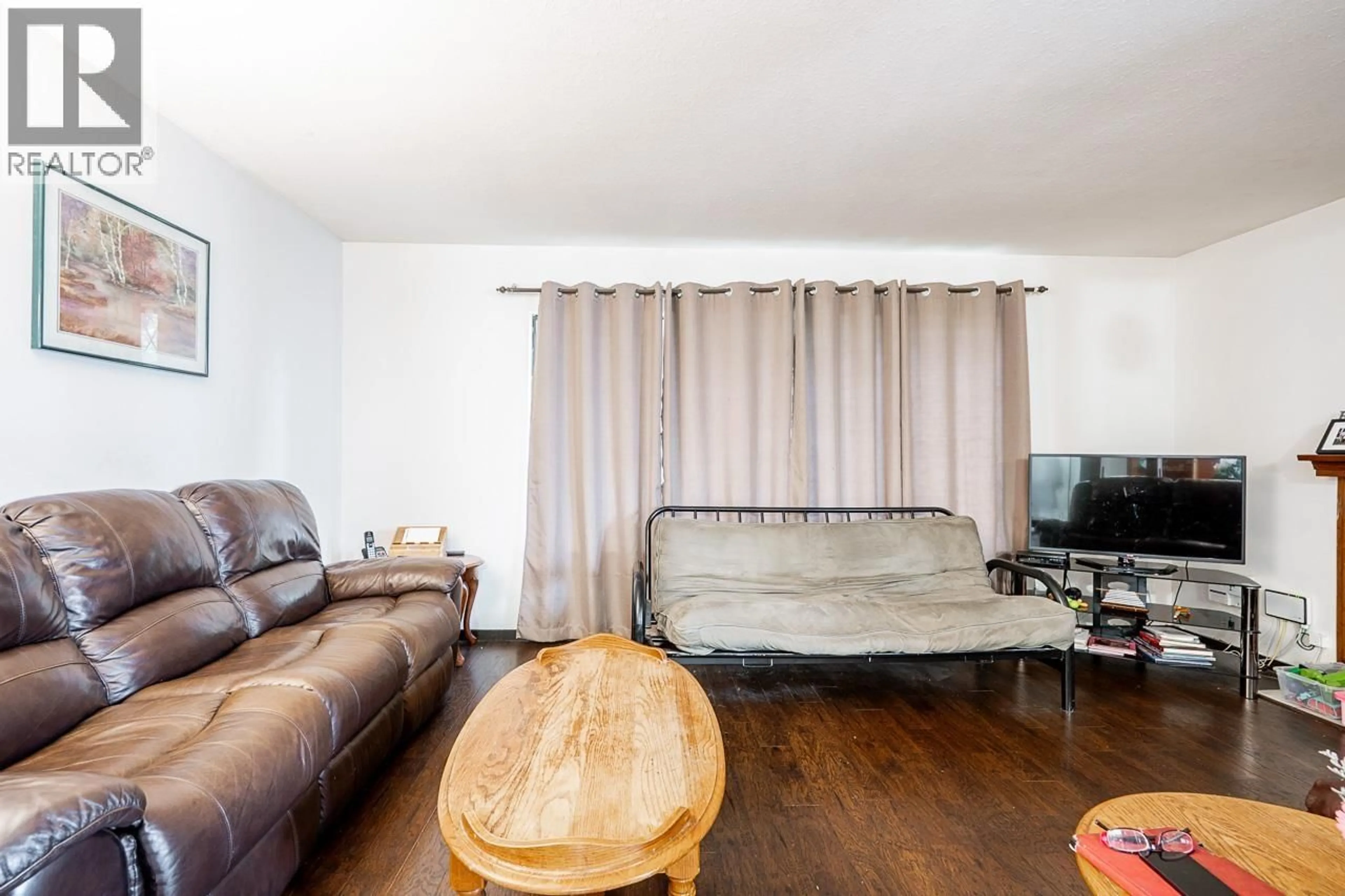 Living room with furniture, wood/laminate floor for 1828 PRAIRIE AVENUE, Port Coquitlam British Columbia V3B1V3