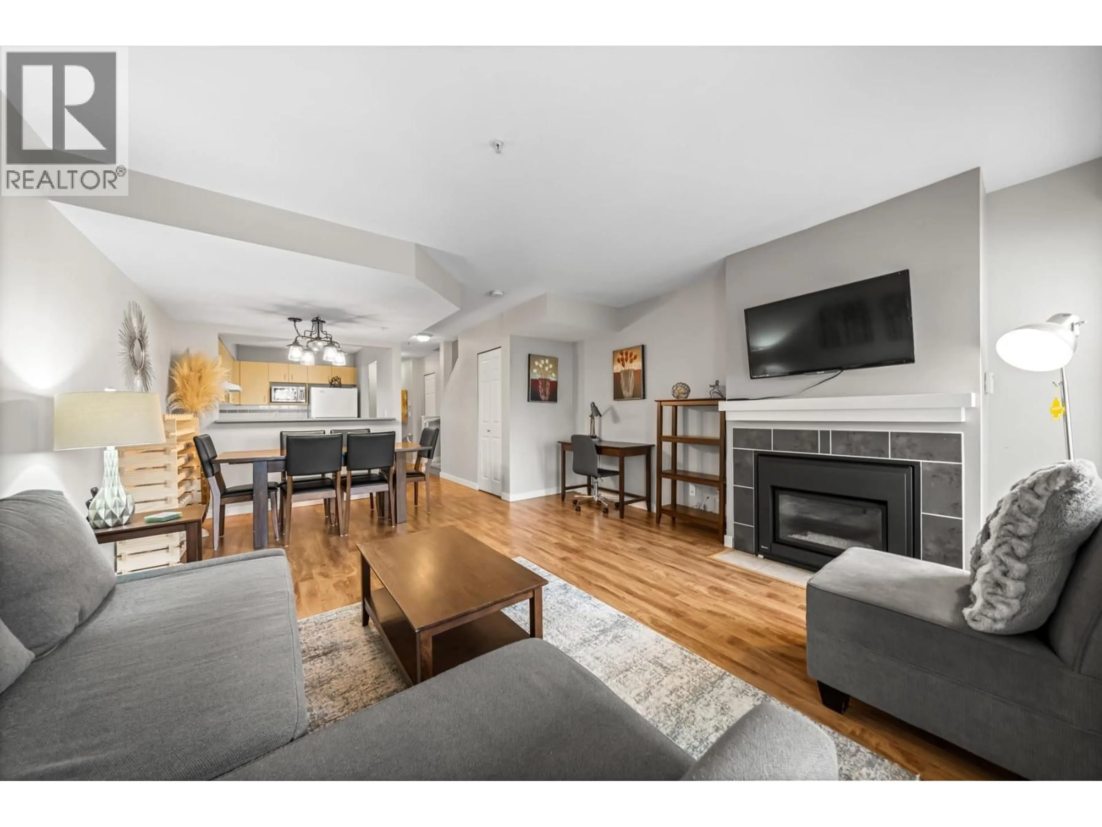 Living room with furniture, wood/laminate floor for 49 - 123 SEVENTH STREET, New Westminster British Columbia V3M6Y2
