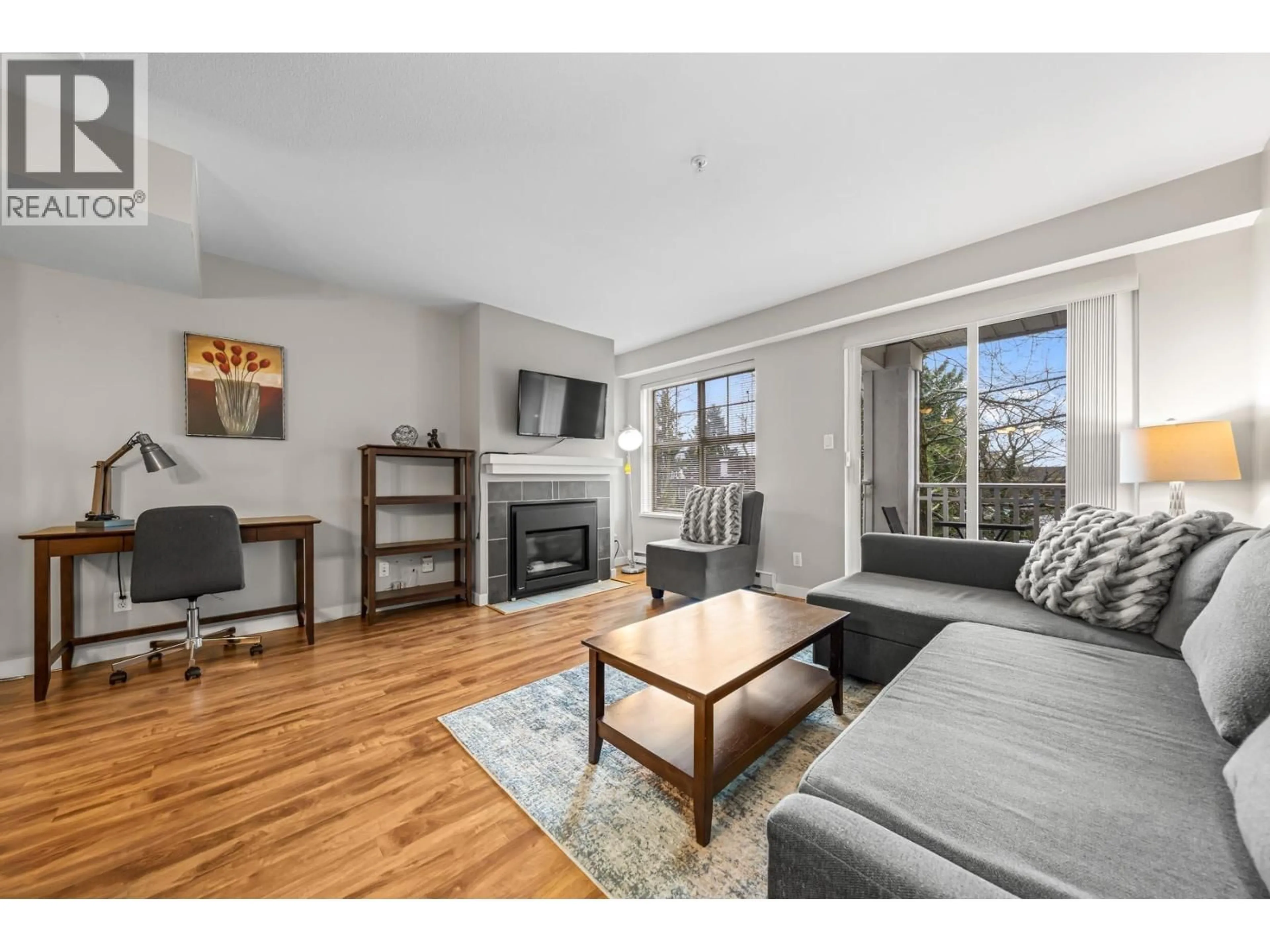 Living room with furniture, wood/laminate floor for 49 - 123 SEVENTH STREET, New Westminster British Columbia V3M6Y2