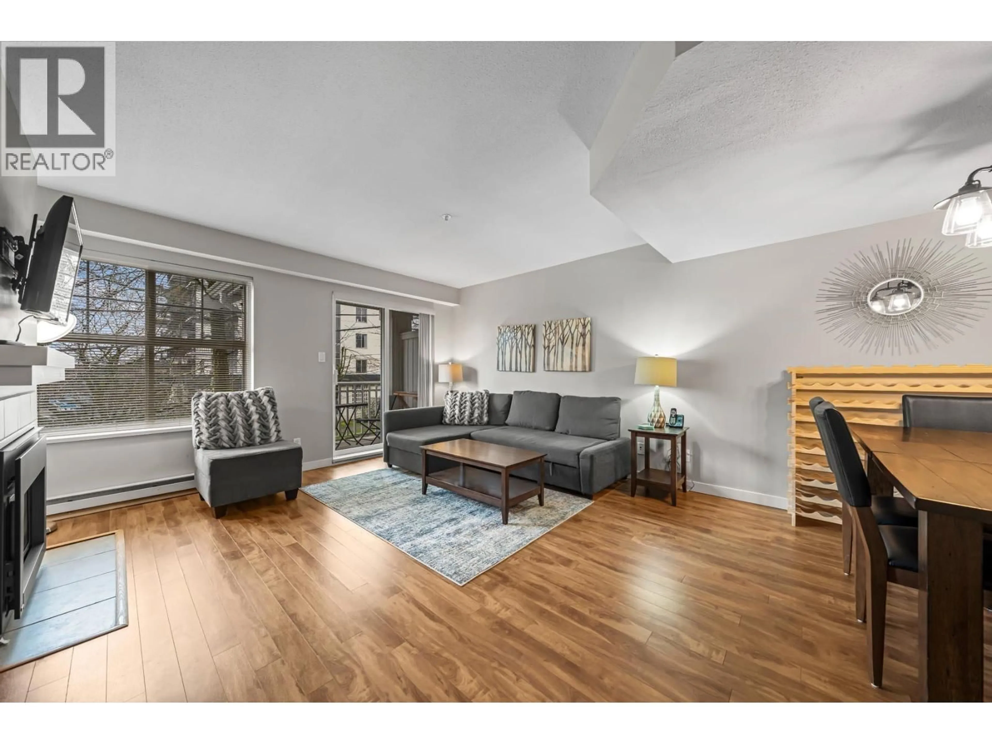 Living room with furniture, wood/laminate floor for 49 - 123 SEVENTH STREET, New Westminster British Columbia V3M6Y2