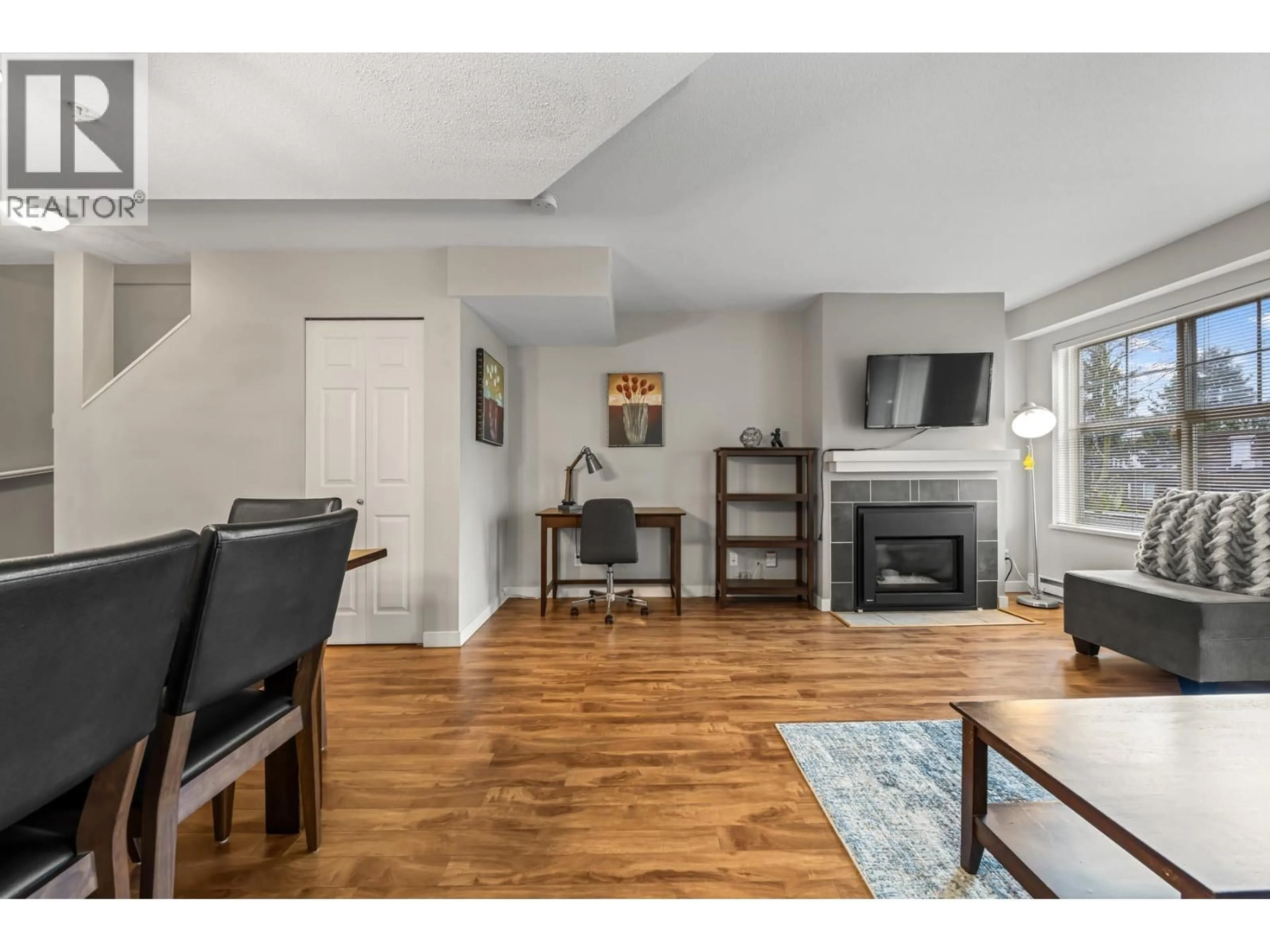 Living room with furniture, wood/laminate floor for 49 - 123 SEVENTH STREET, New Westminster British Columbia V3M6Y2