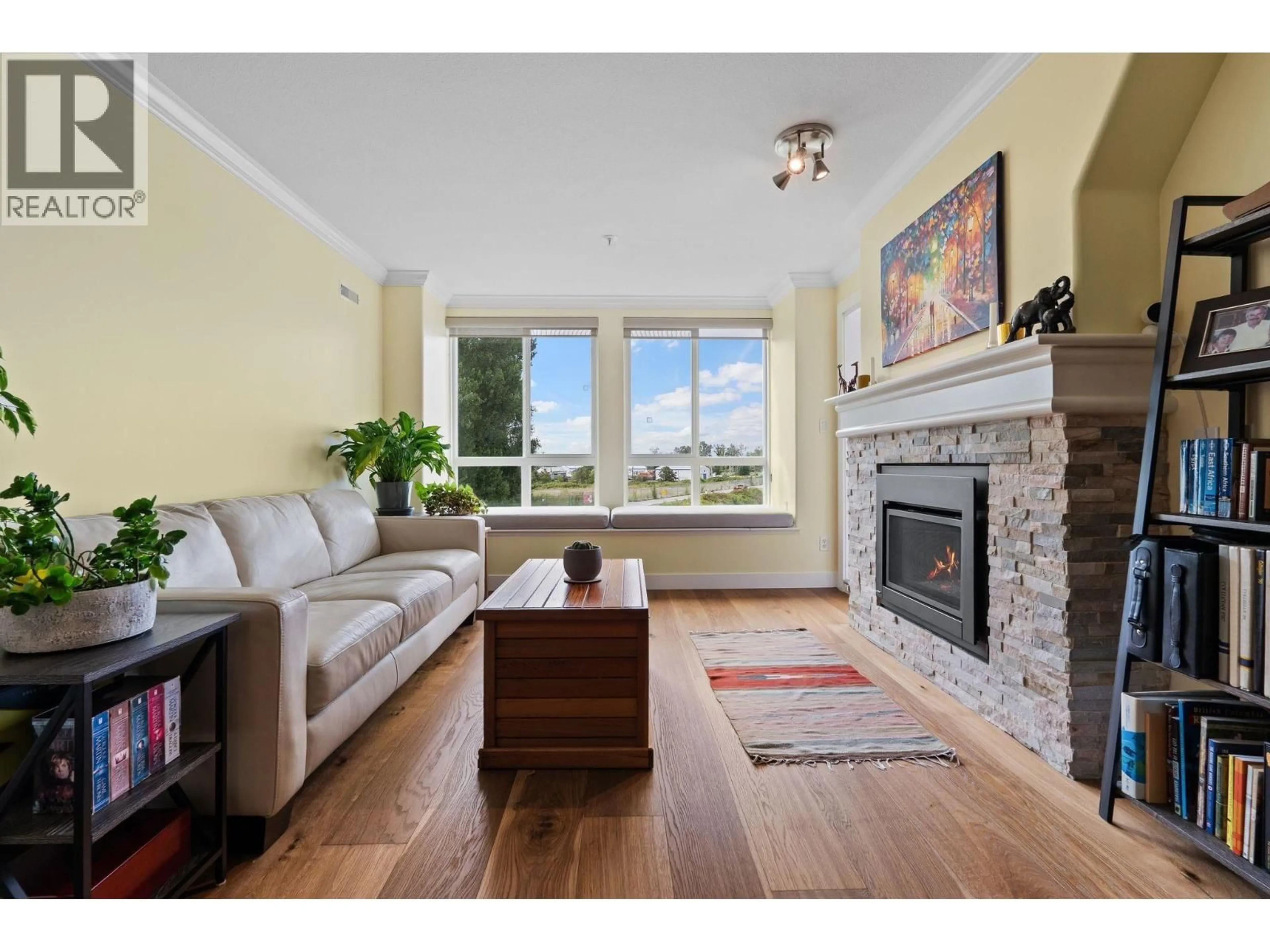 Living room with furniture, wood/laminate floor for 314 - 12639 NO. 2 ROAD, Richmond British Columbia V7E6N6