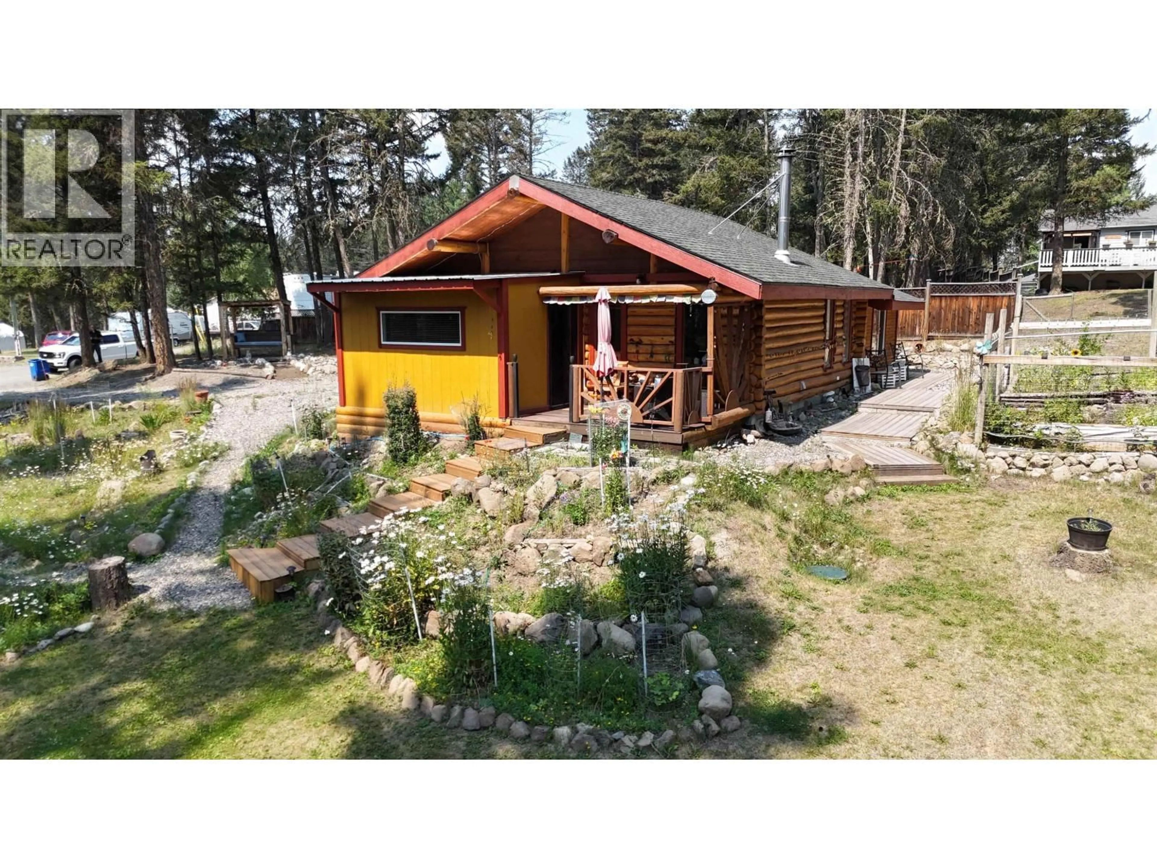 A pic from outside/outdoor area/front of a property/back of a property/a pic from drone, unknown for 4863 CUMSU PLACE, 108 Mile Ranch British Columbia V0K2Z0