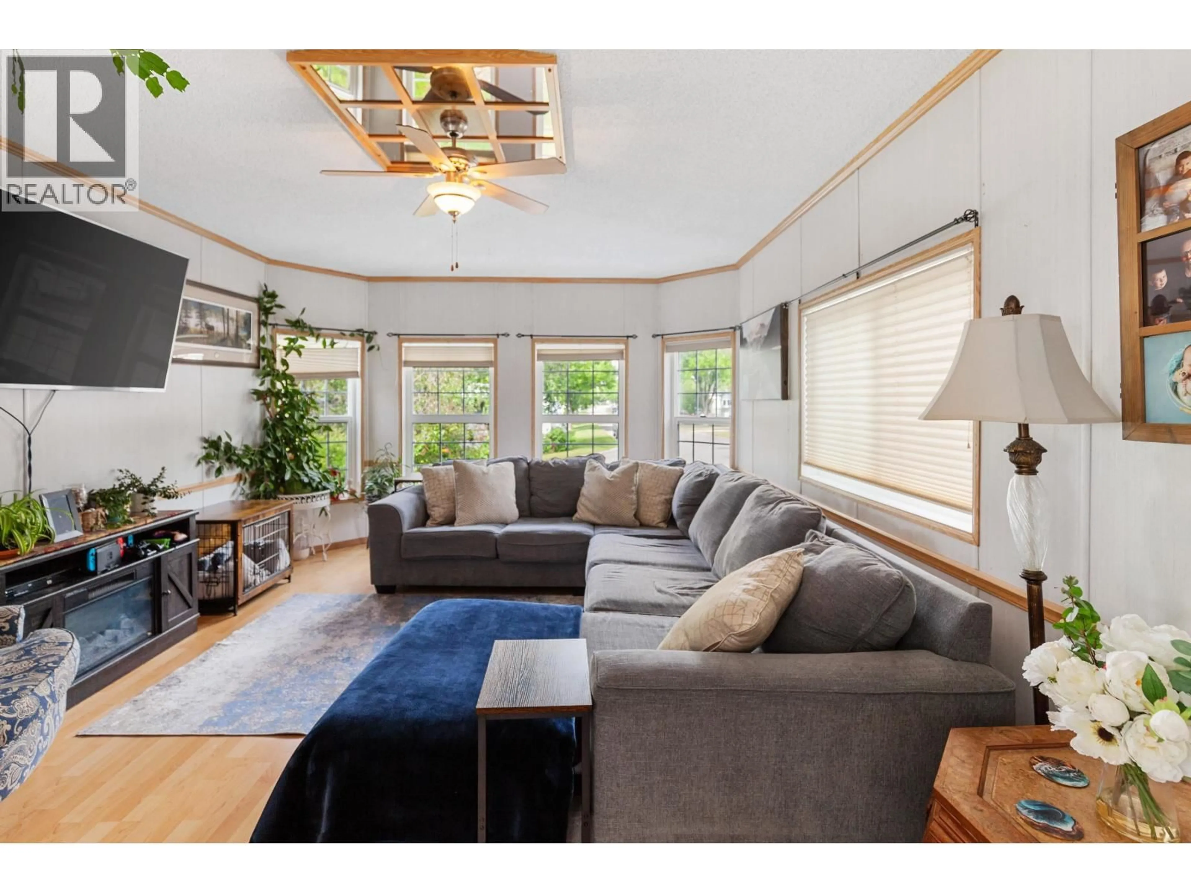 Living room with furniture, wood/laminate floor for 11 - 1000 INVERNESS ROAD, Prince George British Columbia V2K4V1