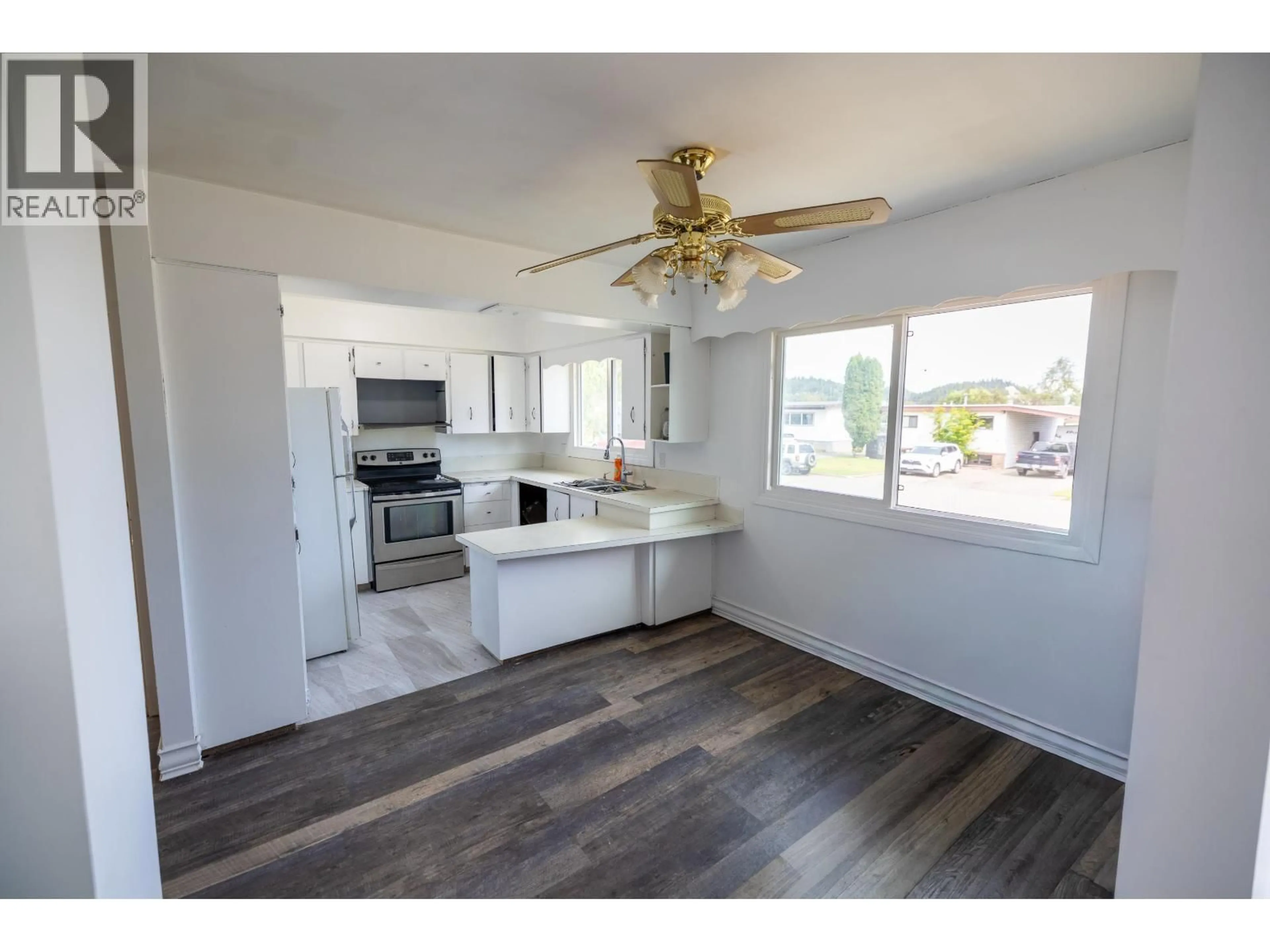Open concept kitchen, wood/laminate floor for 133 MOFFAT STREET, Prince George British Columbia V2M3L2