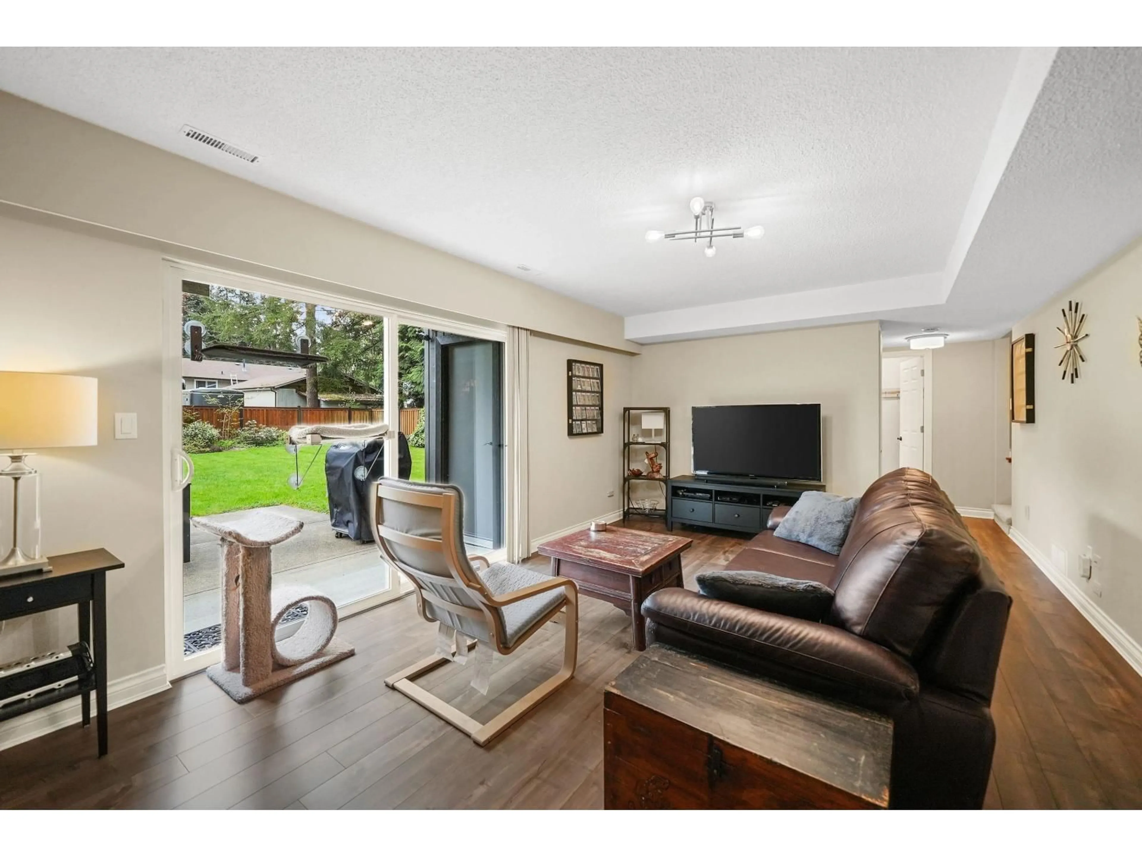 Living room with furniture, wood/laminate floor for 4130 206A STREET, Langley British Columbia V3A2C7