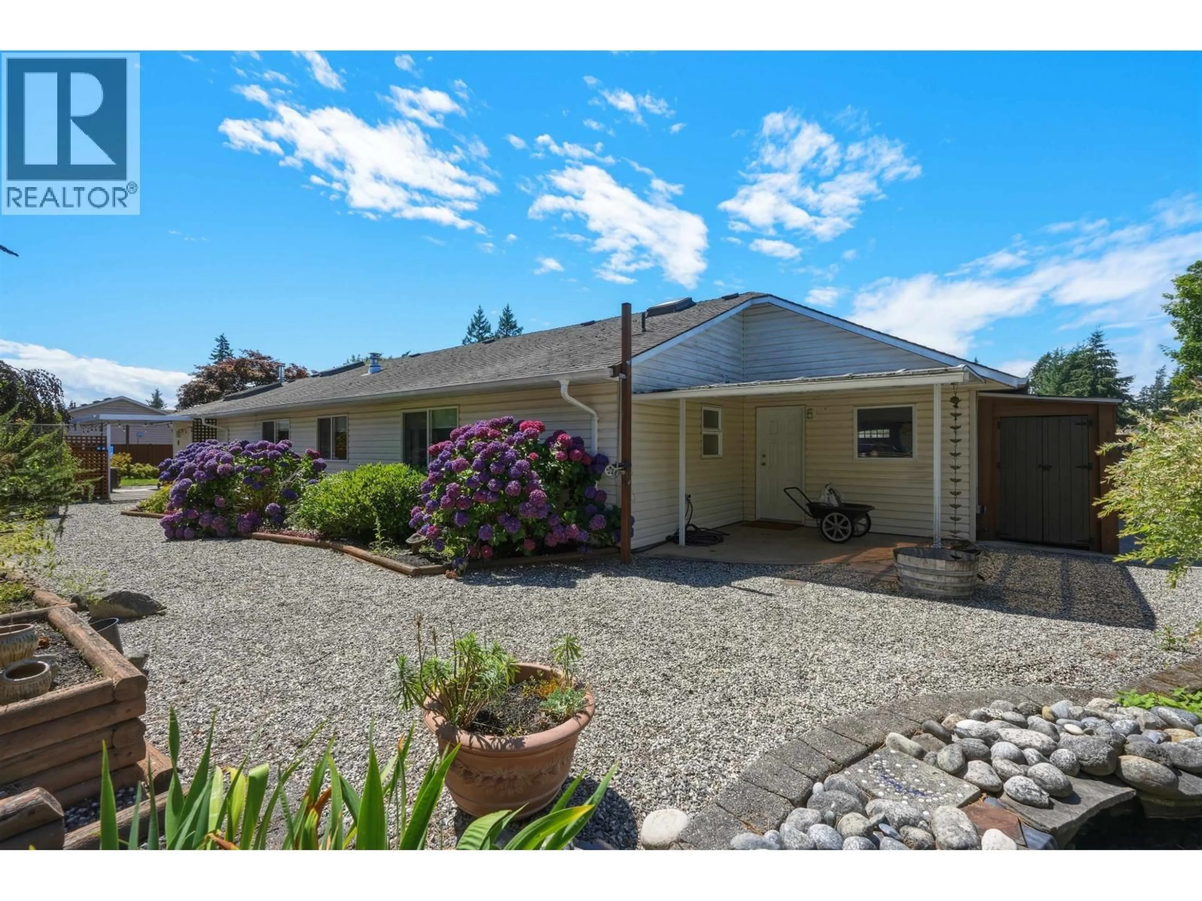 A pic from outside/outdoor area/front of a property/back of a property/a pic from drone, street for 5616 EMERSON ROAD, Sechelt British Columbia V0N3A7