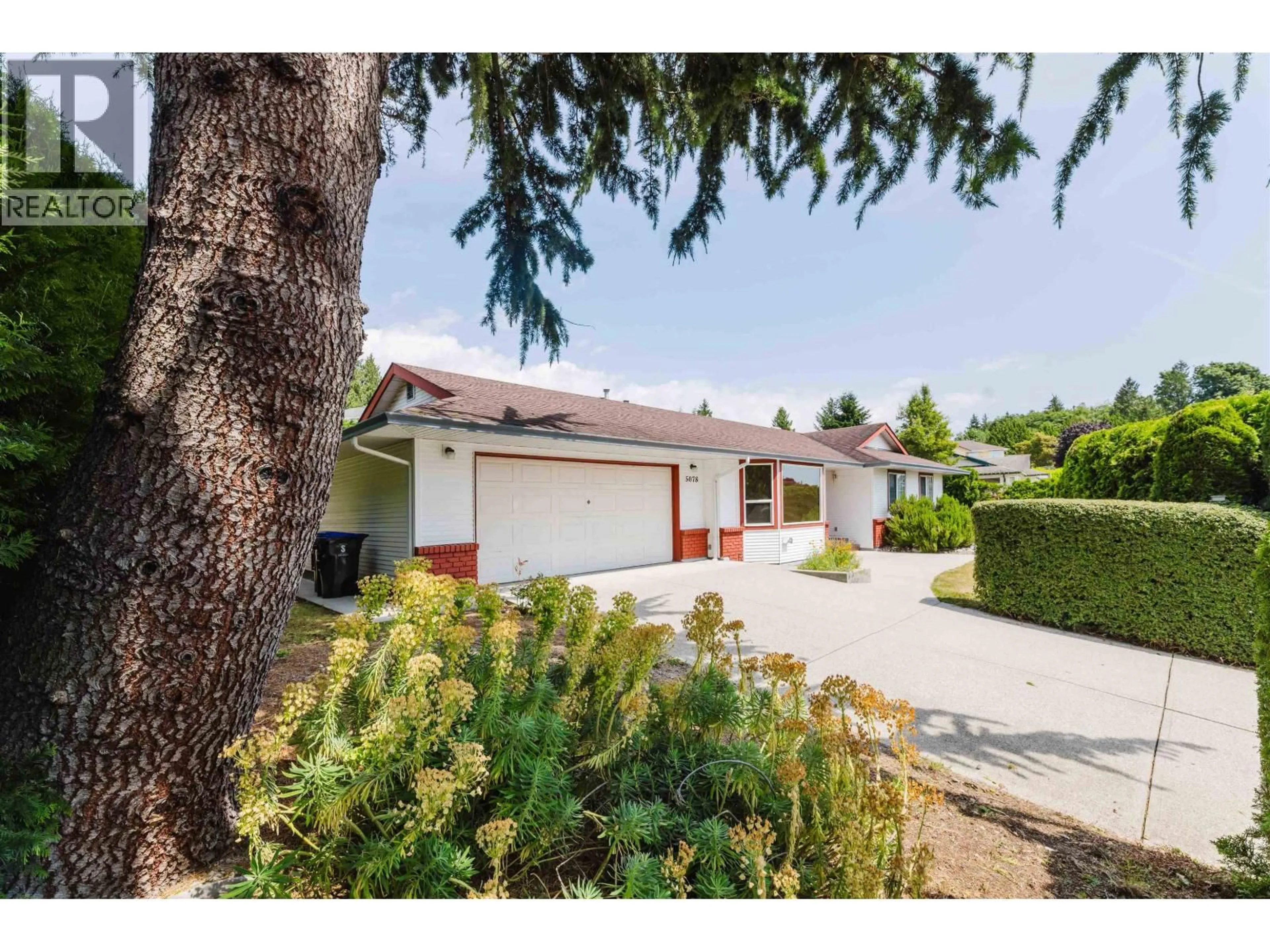 A pic from outside/outdoor area/front of a property/back of a property/a pic from drone, street for 5078 BAY ROAD, Sechelt British Columbia V7Z0E9
