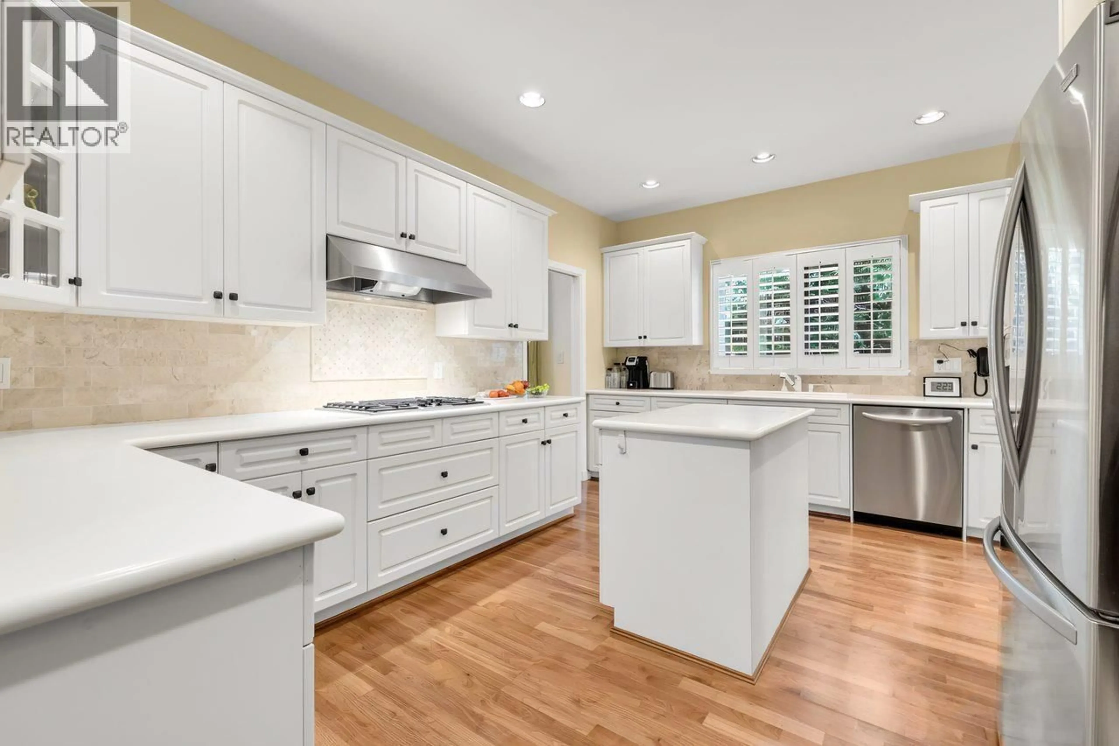 Open concept kitchen, ceramic/tile floor for 206 - 6505 3 AVENUE, Delta British Columbia V4L2N1