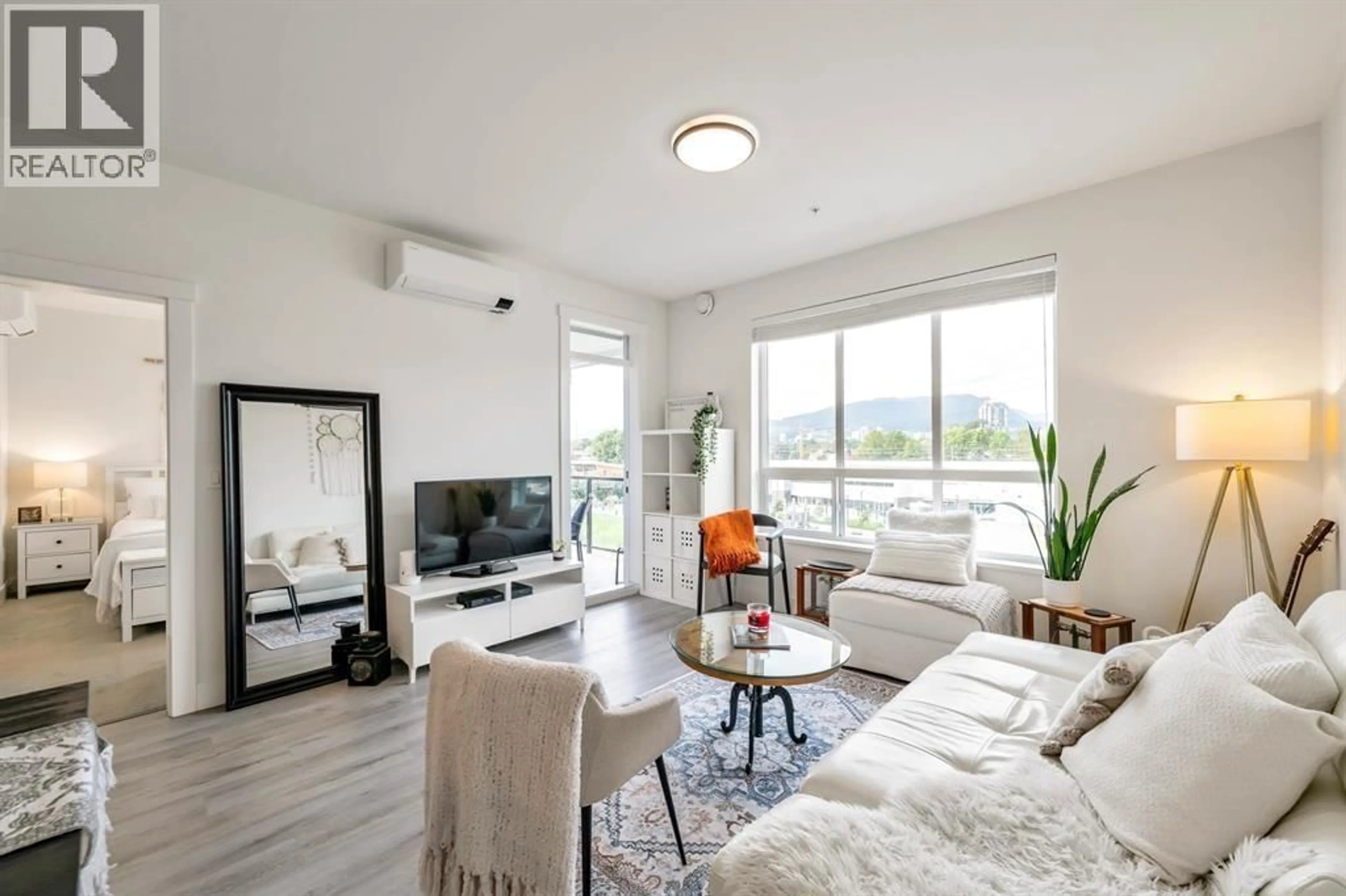 Living room with furniture, wood/laminate floor for 2506 - 2180 KELLY AVENUE, Port Coquitlam British Columbia V3C0S5