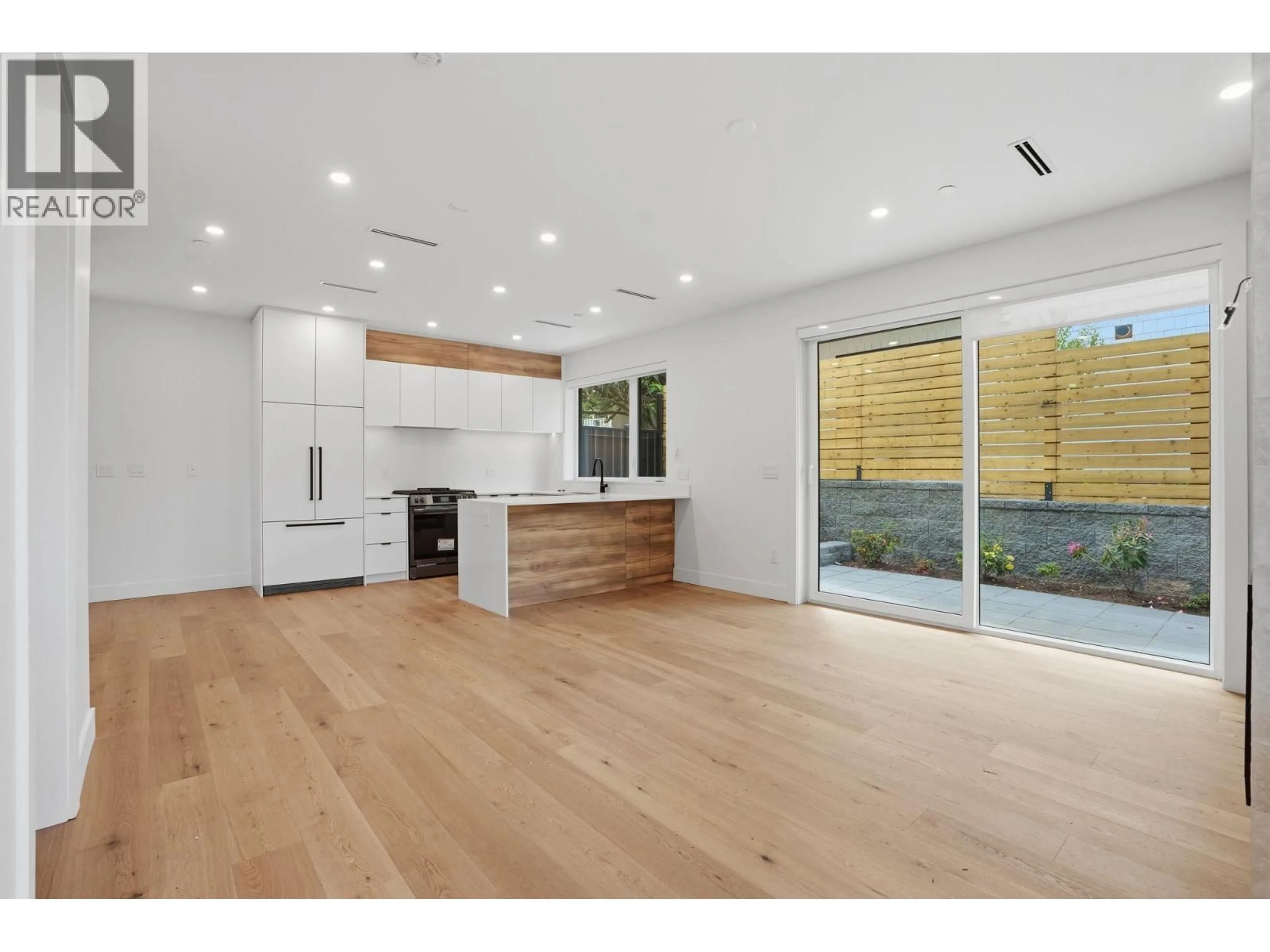 Open concept kitchen, wood/laminate floor for 2 - 2438 20TH AVENUE, Vancouver British Columbia V5M2T6