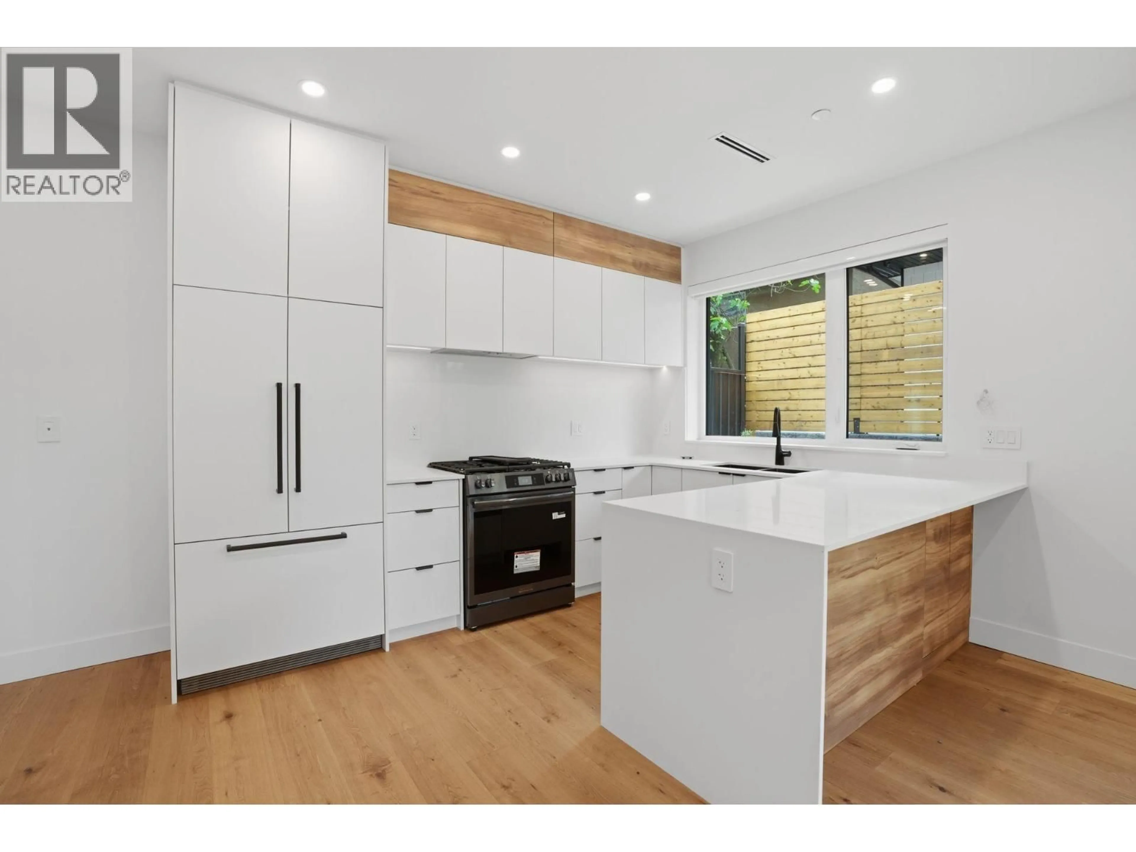 Contemporary kitchen, wood/laminate floor for 2 - 2438 20TH AVENUE, Vancouver British Columbia V5M2T6