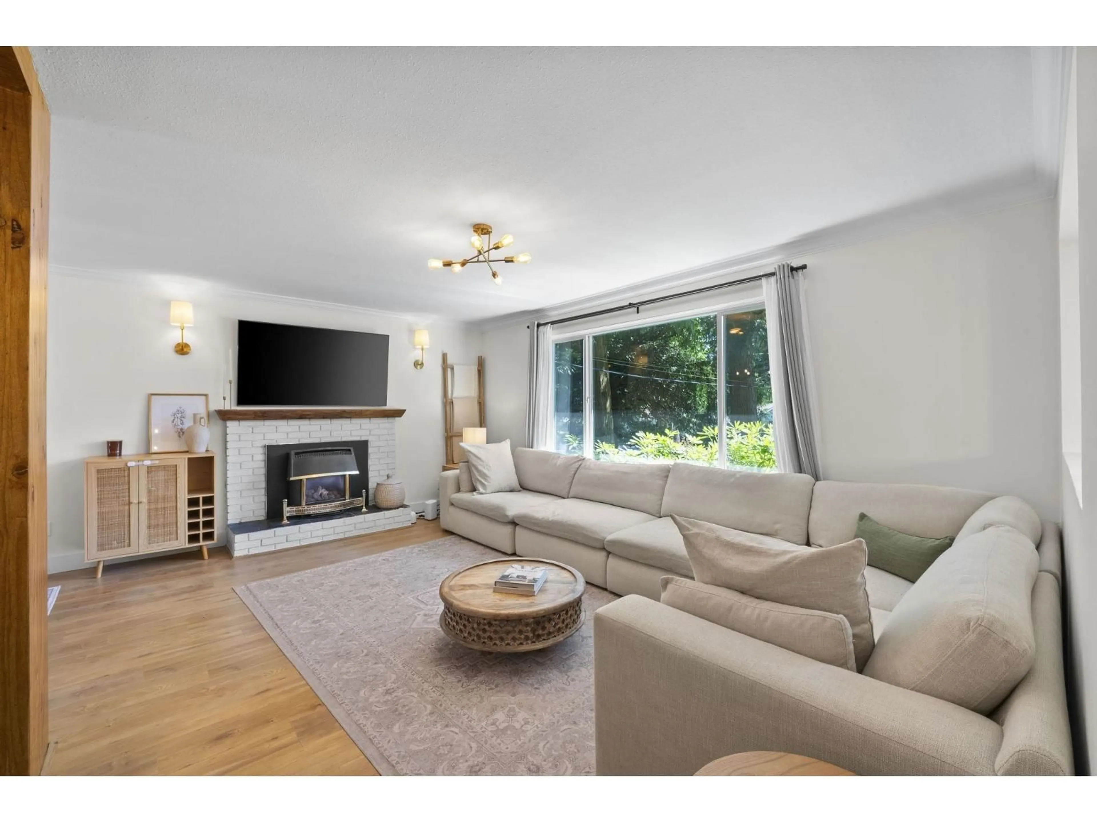 Living room with furniture, wood/laminate floor for 19847 38A AVENUE, Langley British Columbia V3A2V1