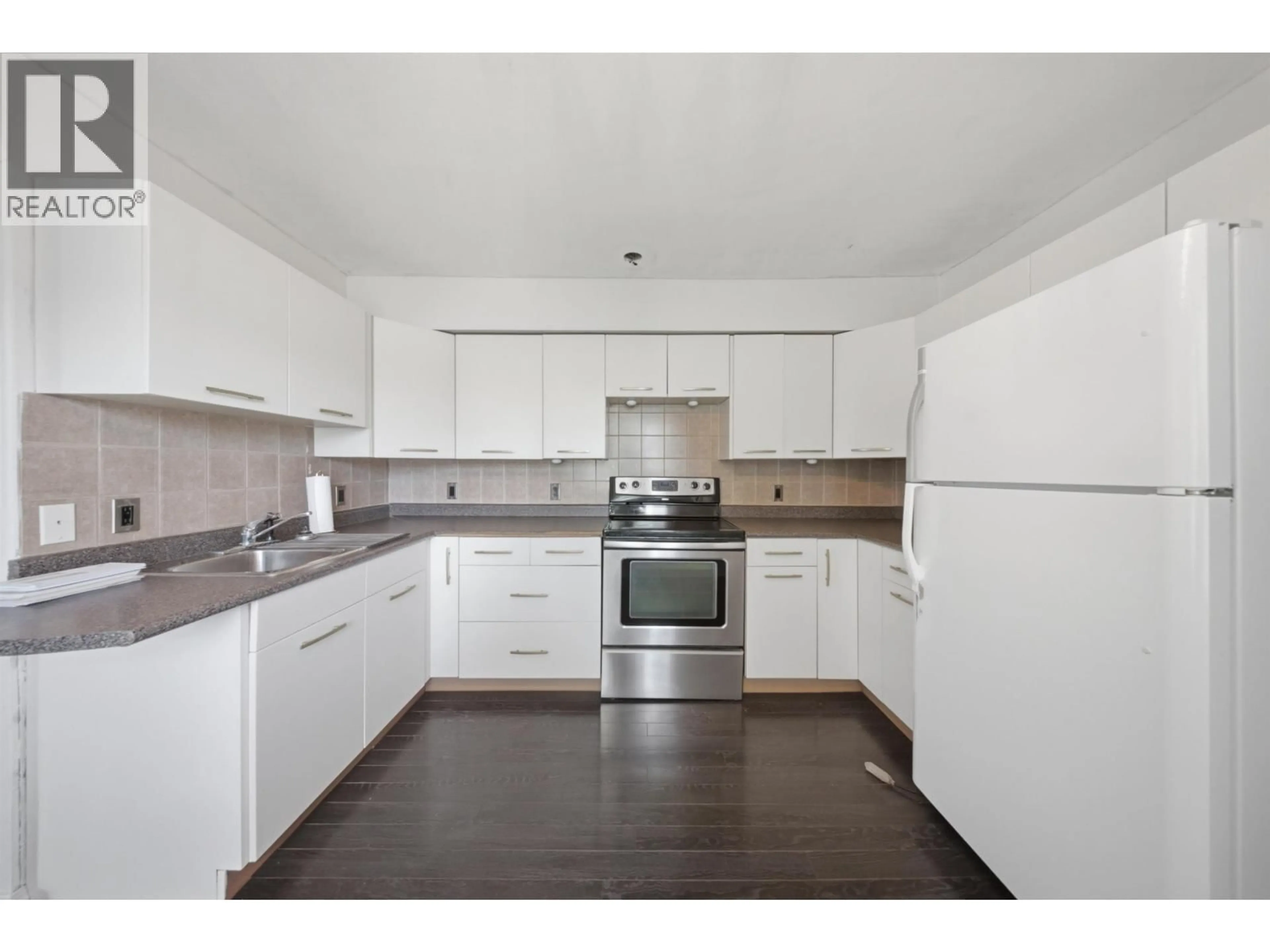 Standard kitchen, wood/laminate floor for 9311 103 AVENUE, Fort St. John British Columbia V1J2G6