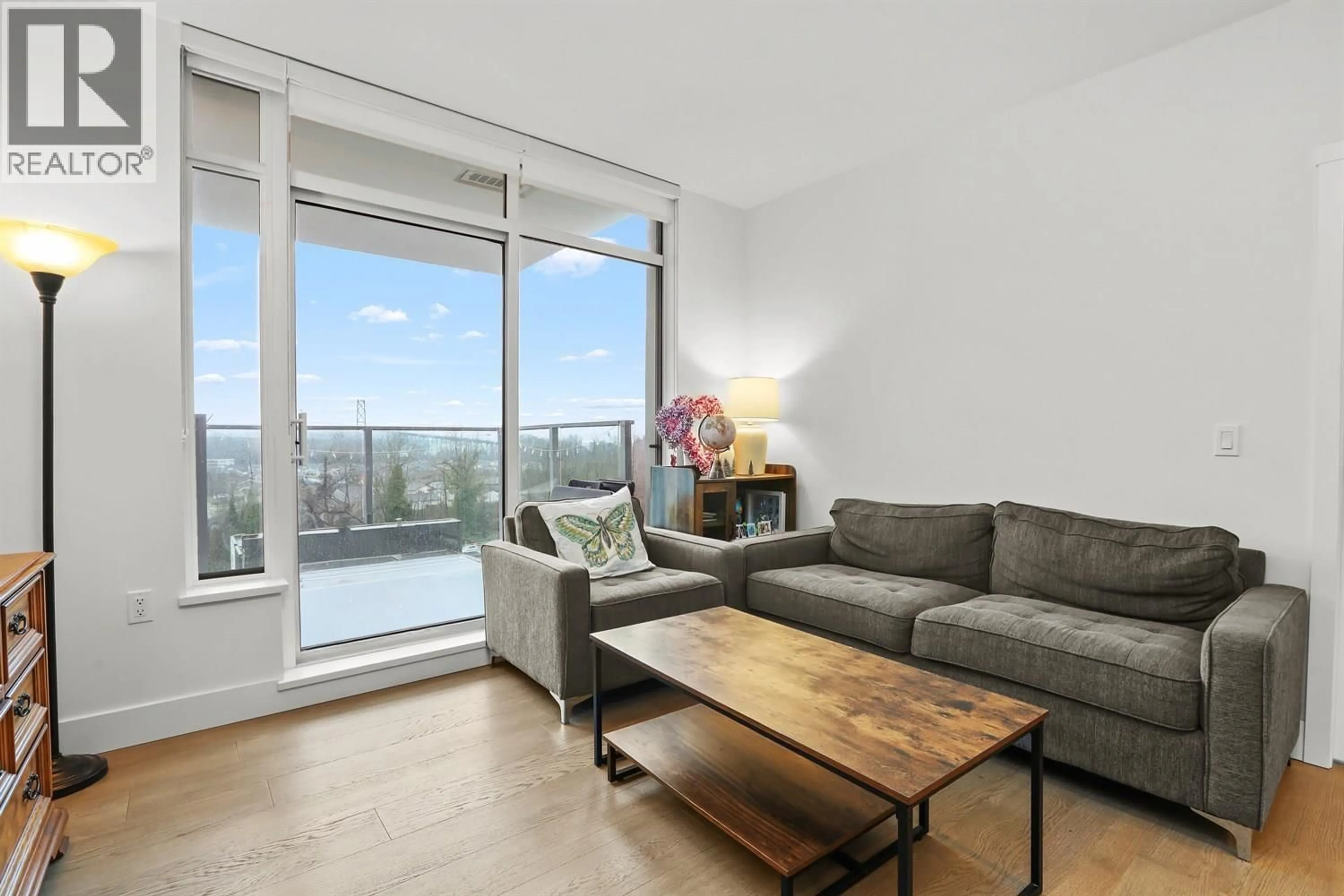 Living room with furniture, wood/laminate floor for 704 - 1675 LIONS GATE LANE, North Vancouver British Columbia V7P3B4