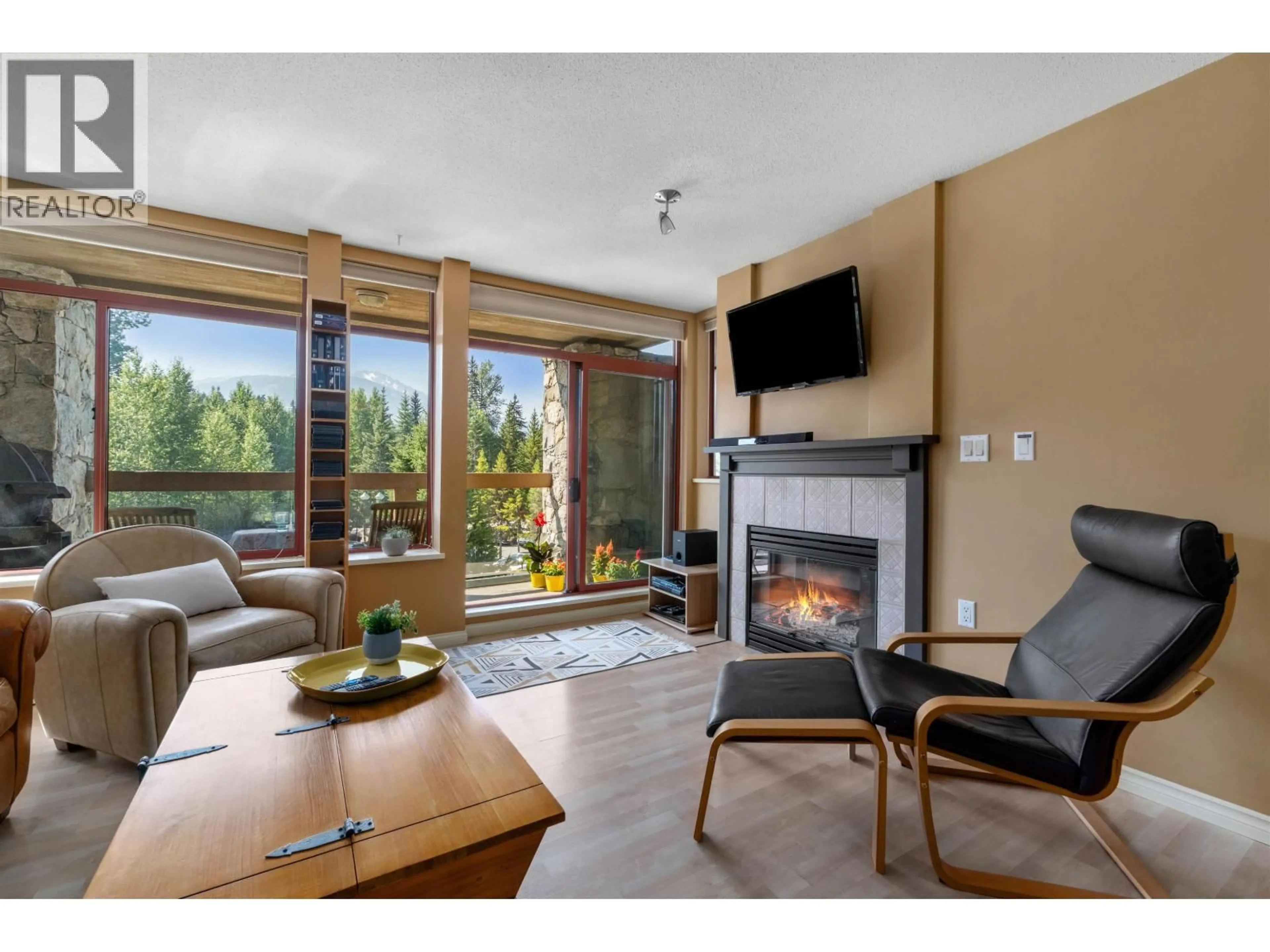 Living room with furniture, wood/laminate floor for 209 - 8080 NICKLAUS NORTH BOULEVARD, Whistler British Columbia V8E1J7