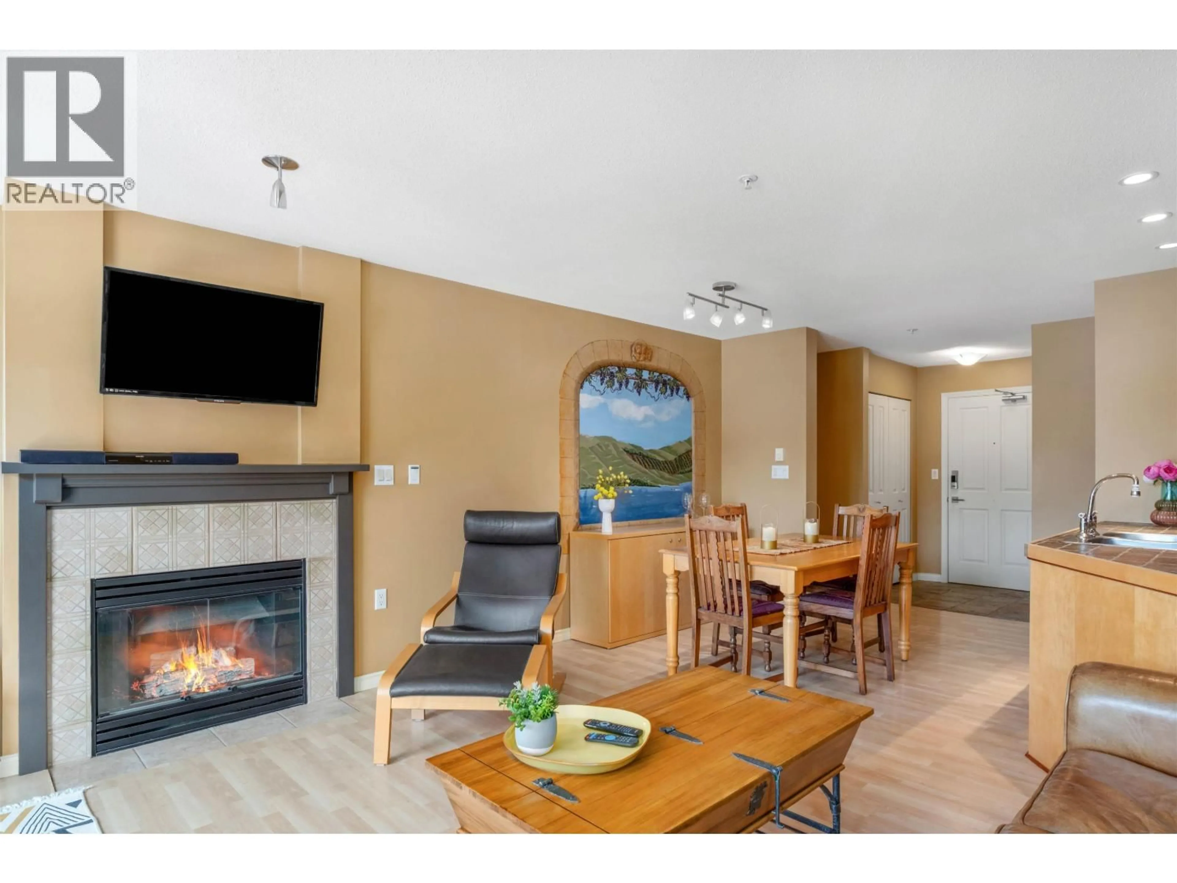Living room with furniture, wood/laminate floor for 209 - 8080 NICKLAUS NORTH BOULEVARD, Whistler British Columbia V8E1J7