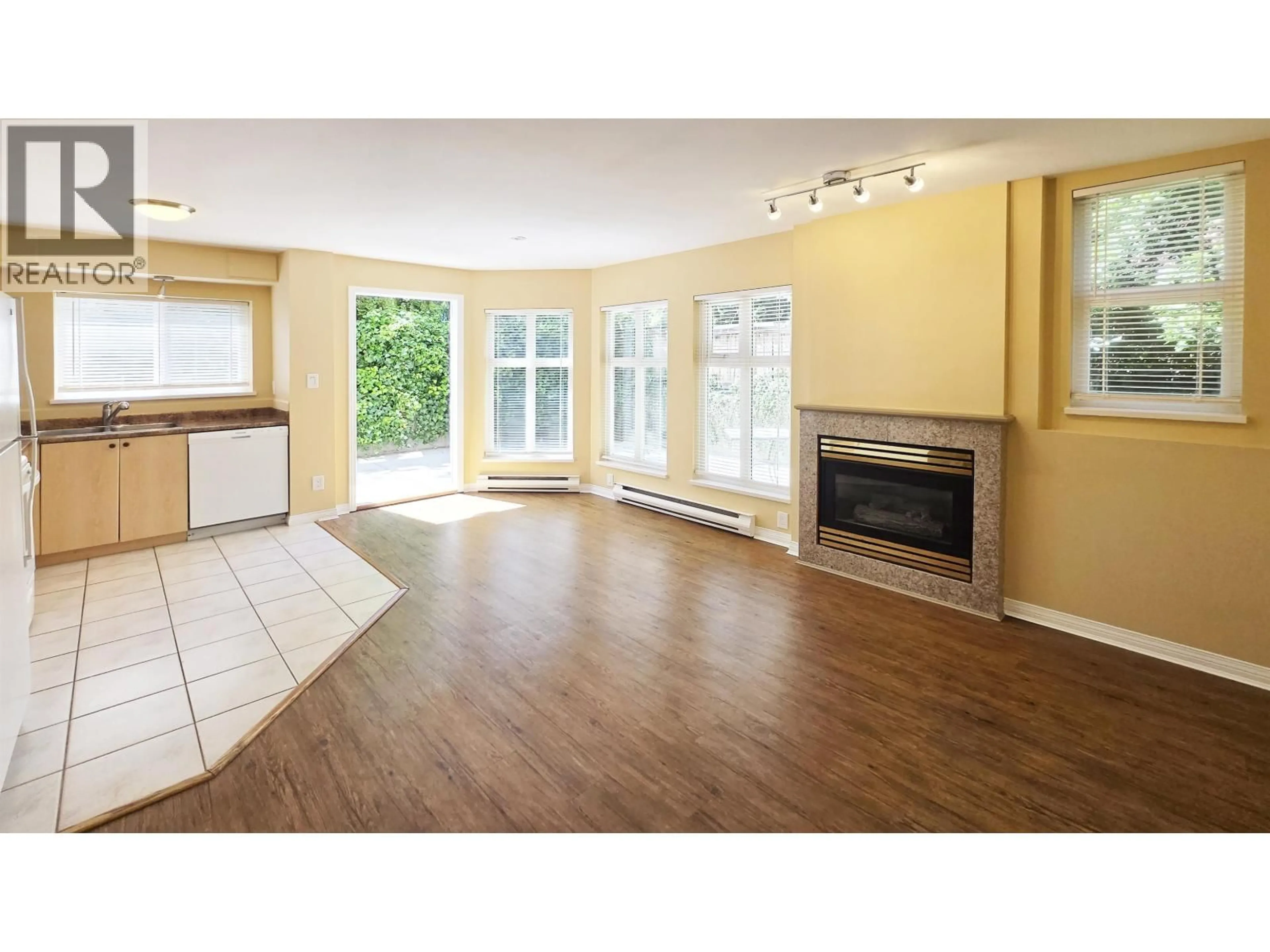 Living room with furniture, wood/laminate floor for 101 - 1099 71ST AVENUE, Vancouver British Columbia V6P6Y5