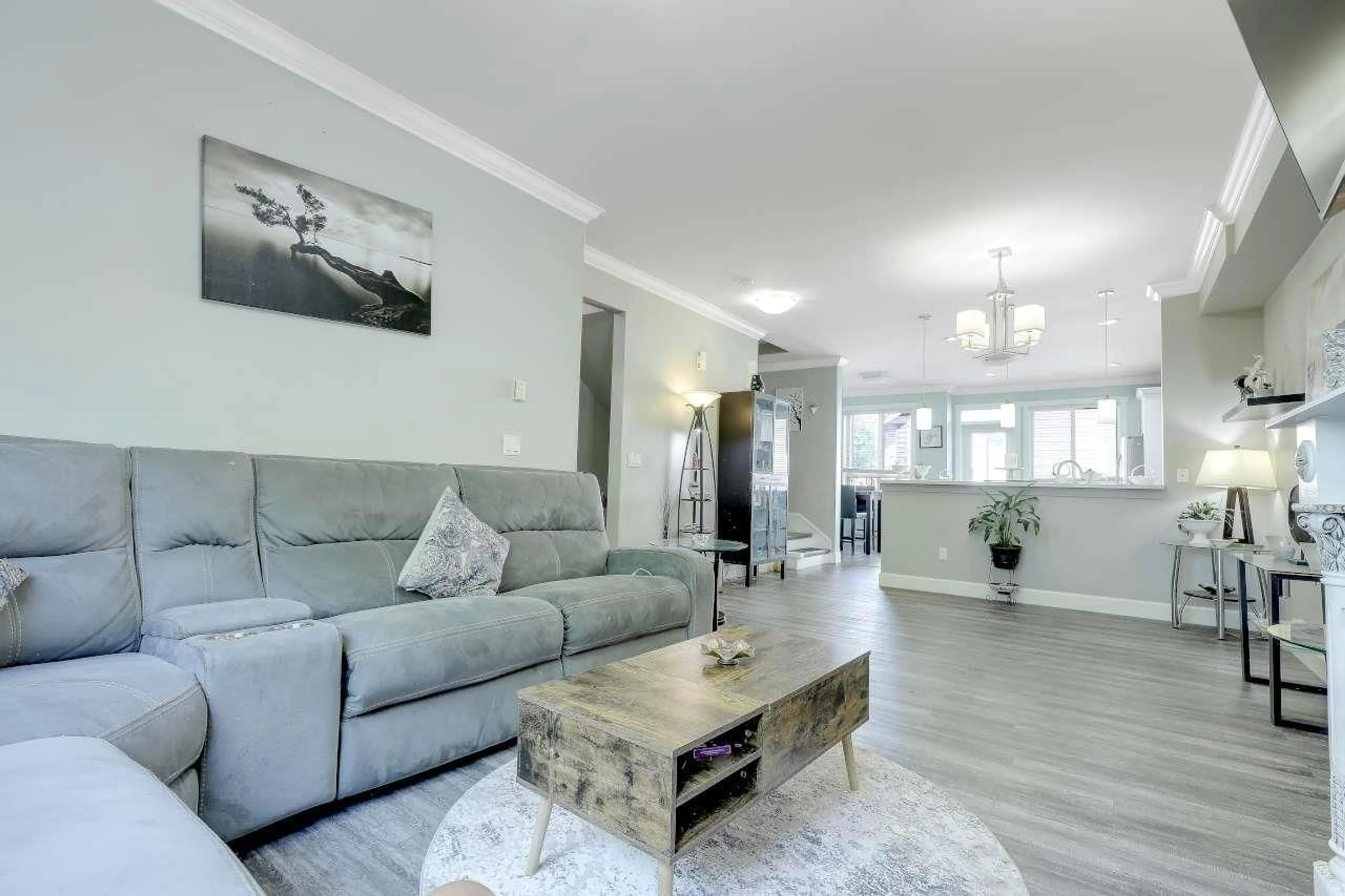 Living room with furniture, wood/laminate floor for 21 - 19560 68 AVENUE, Surrey British Columbia V4N5Y5