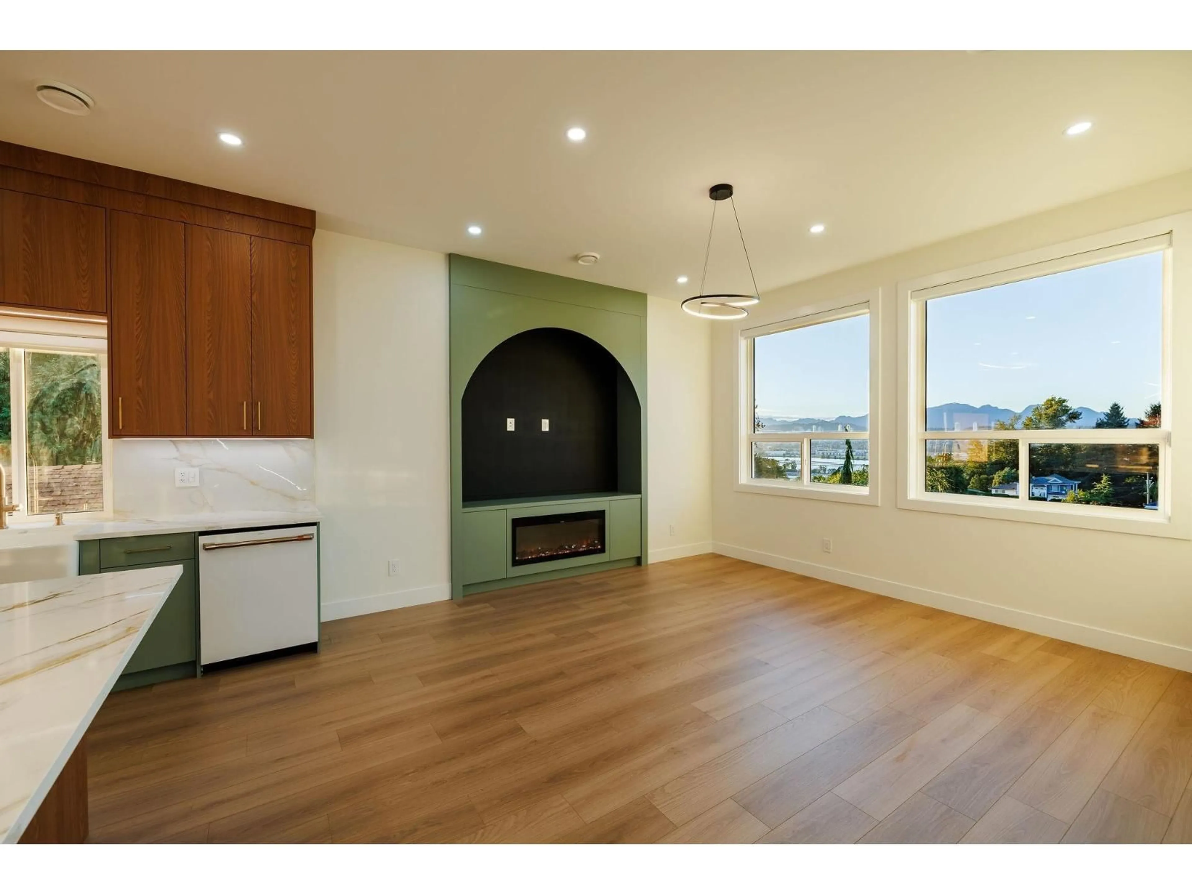 Open concept kitchen, wood/laminate floor for 102 - 11313 137 STREET, Surrey British Columbia V3R2J2