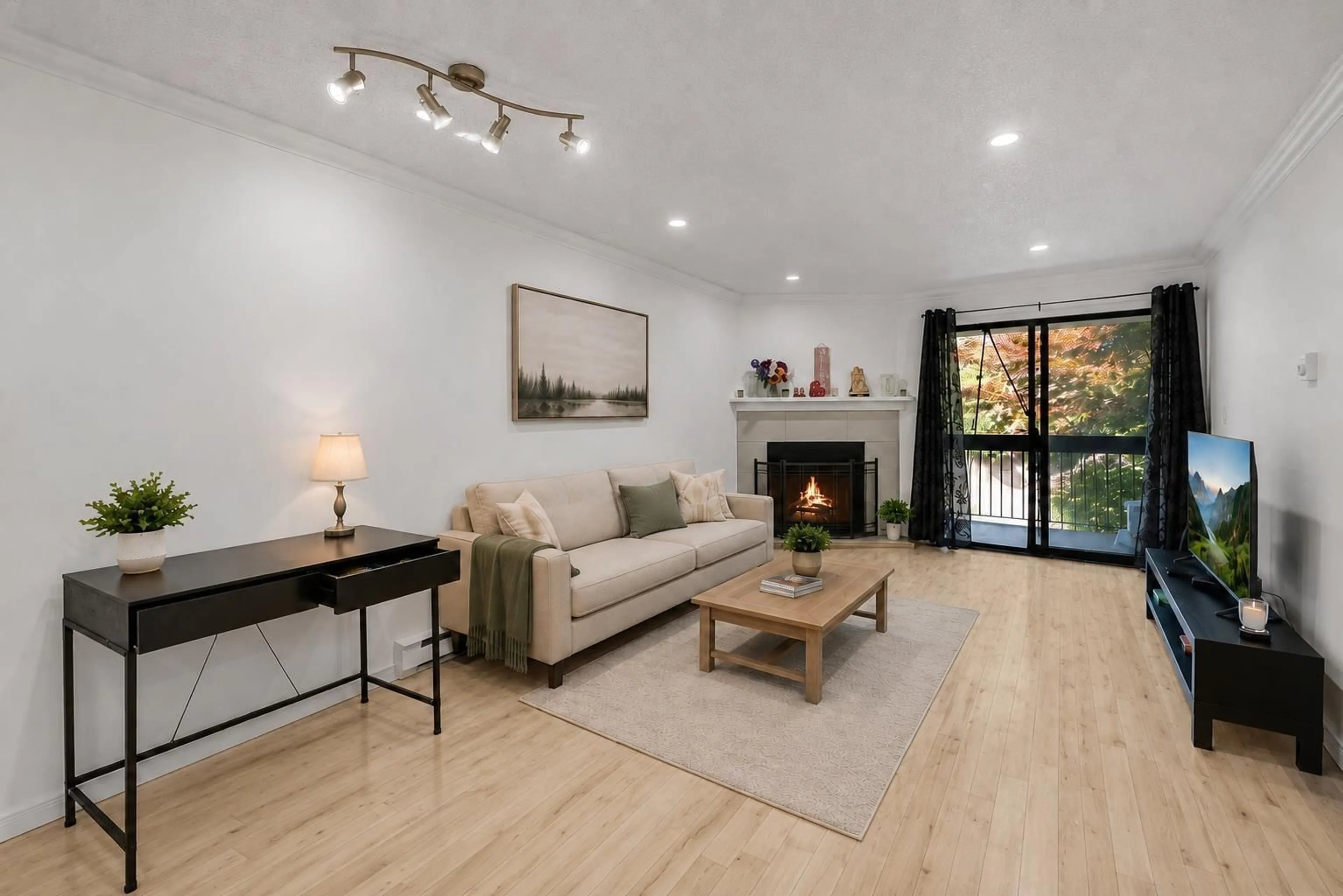 Living room with furniture, wood/laminate floor for 201 - 10560 154 STREET, Surrey British Columbia V3R8A3