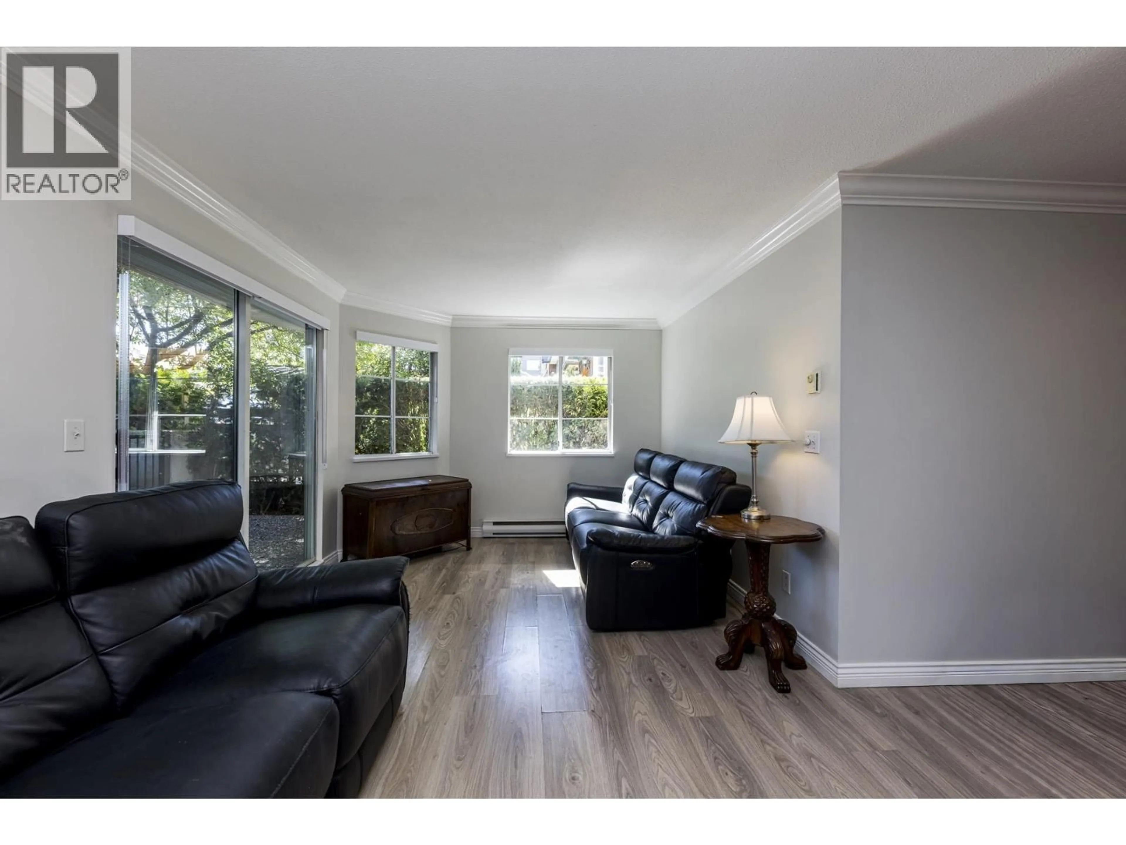 Living room with furniture, wood/laminate floor for 7 - 249 4TH STREET, North Vancouver British Columbia V7L1J1