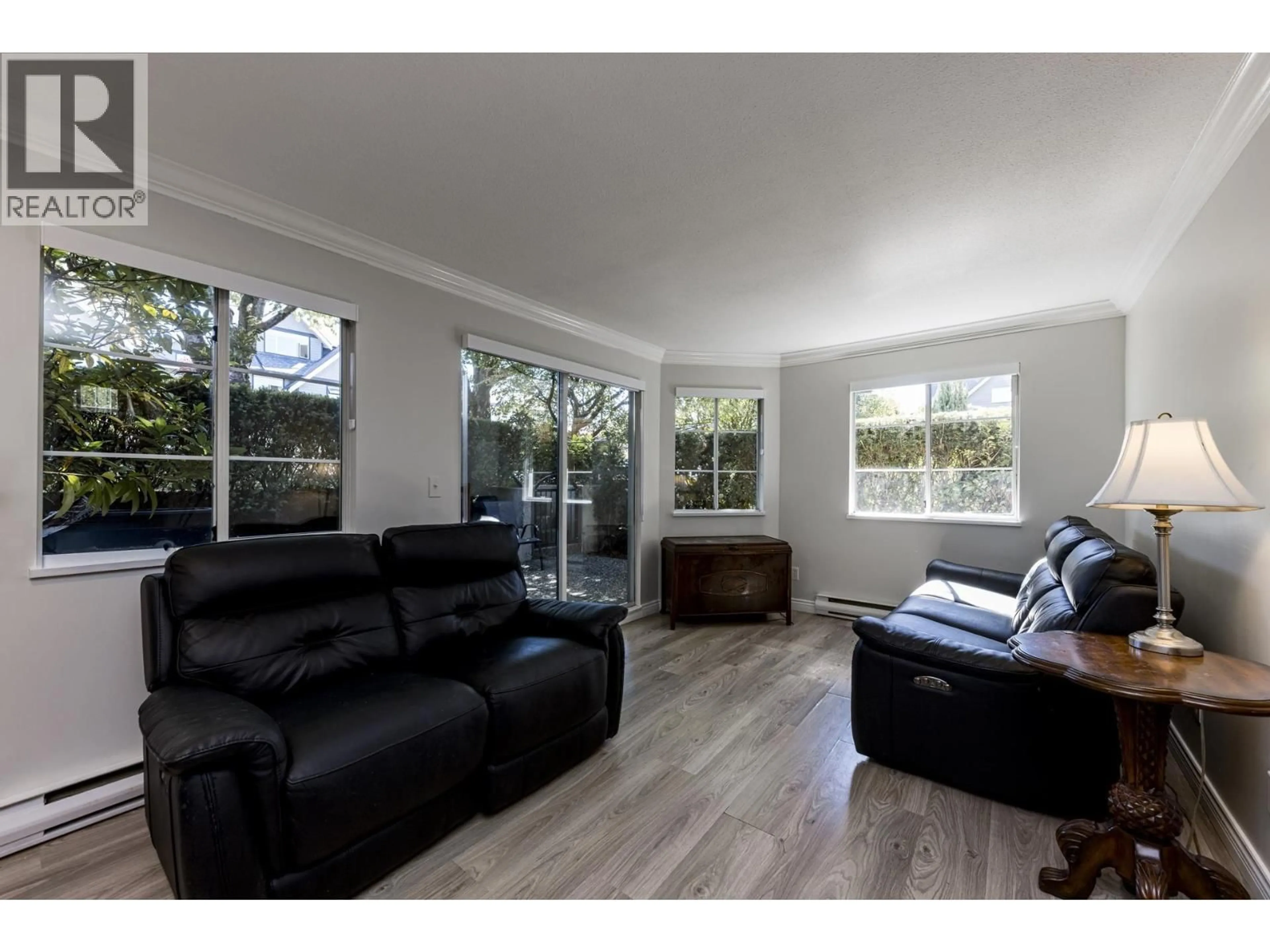 Living room with furniture, wood/laminate floor for 7 - 249 4TH STREET, North Vancouver British Columbia V7L1J1