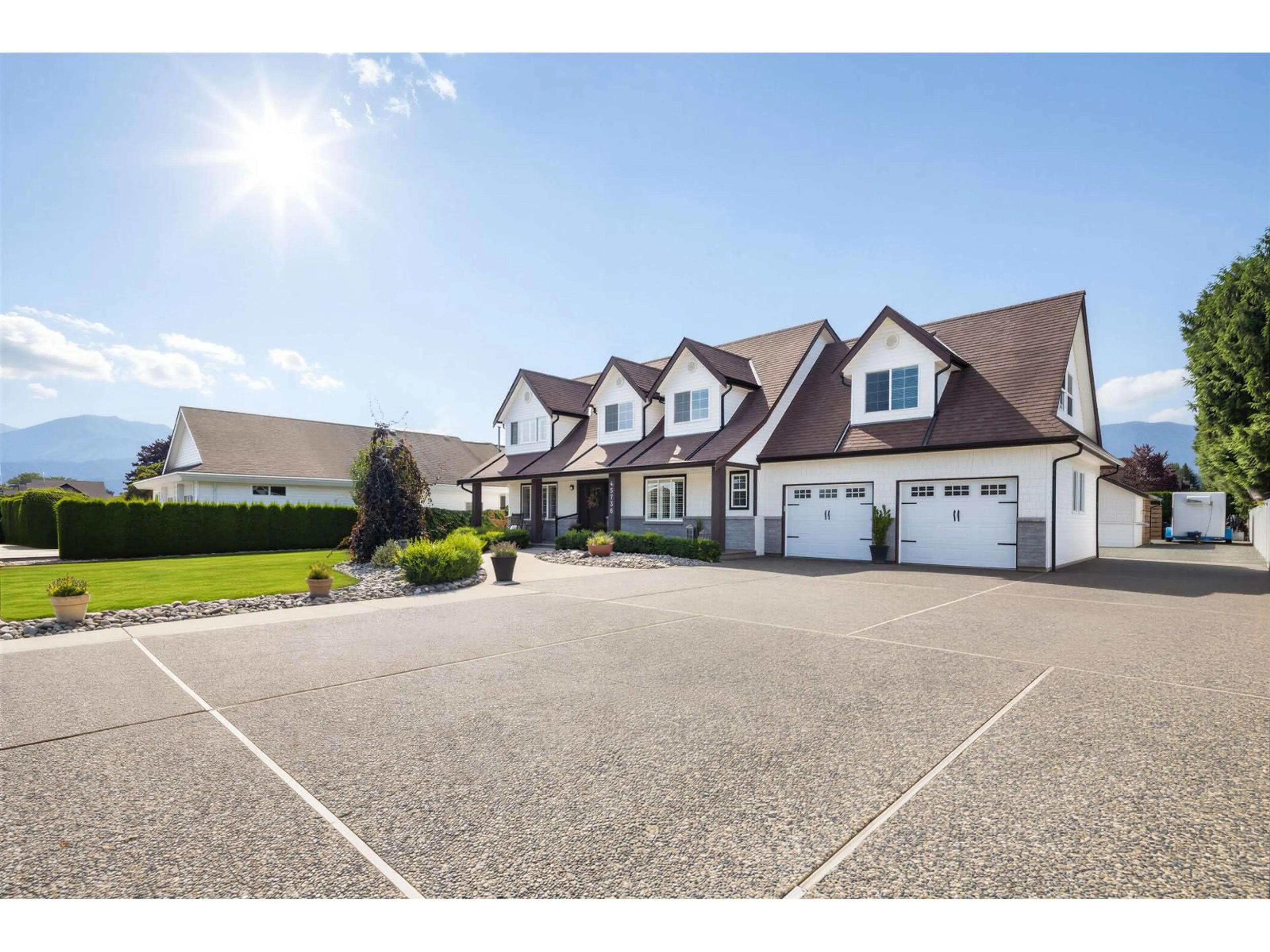 A pic from outside/outdoor area/front of a property/back of a property/a pic from drone, street for 45736 HIGGINSON ROAD, Chilliwack British Columbia V2R1C9