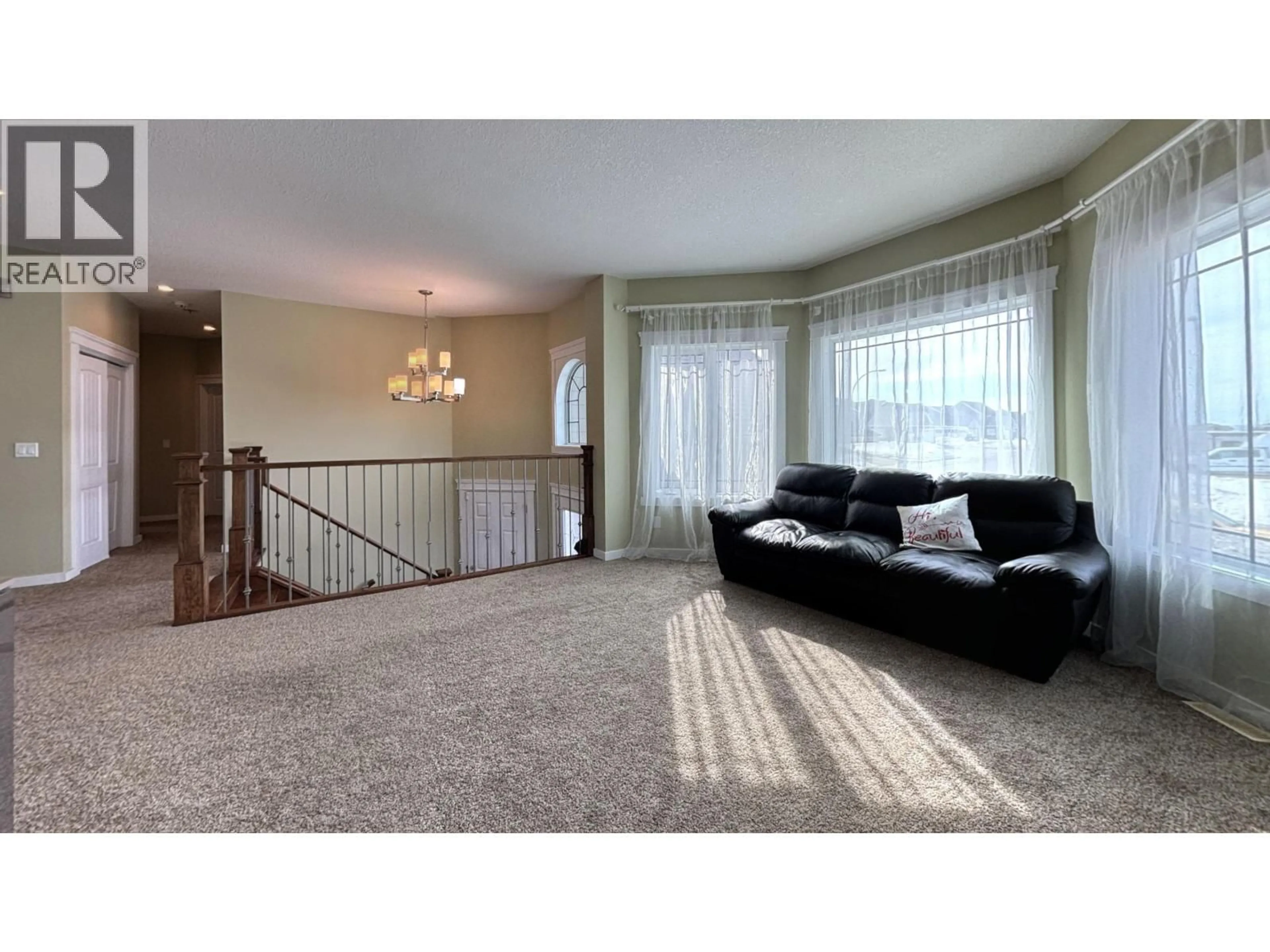 Living room with furniture, carpet floor for 10904 108 AVENUE, Fort St. John British Columbia V1J0J3
