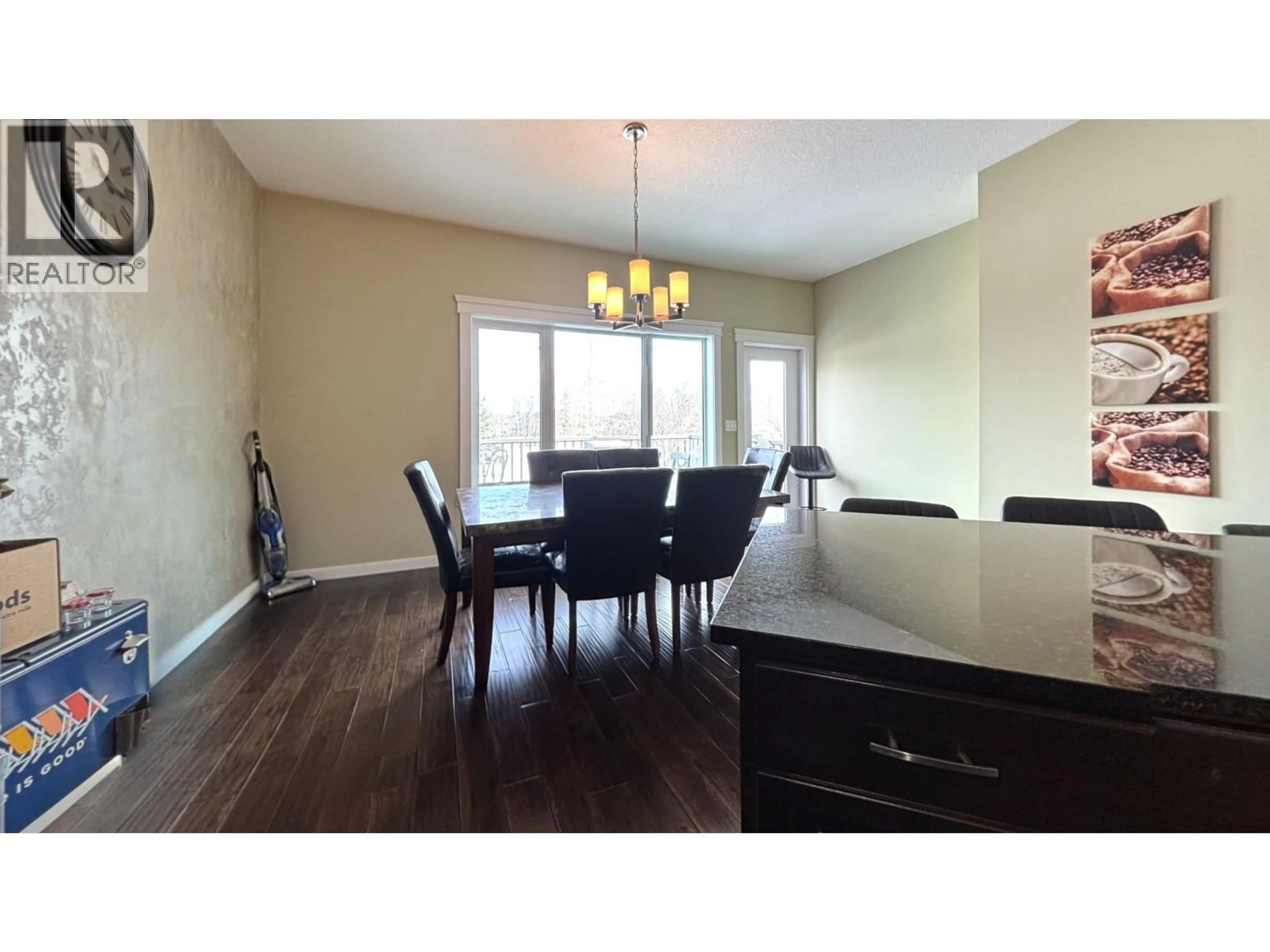 Open concept kitchen, wood/laminate floor for 10904 108 AVENUE, Fort St. John British Columbia V1J0J3