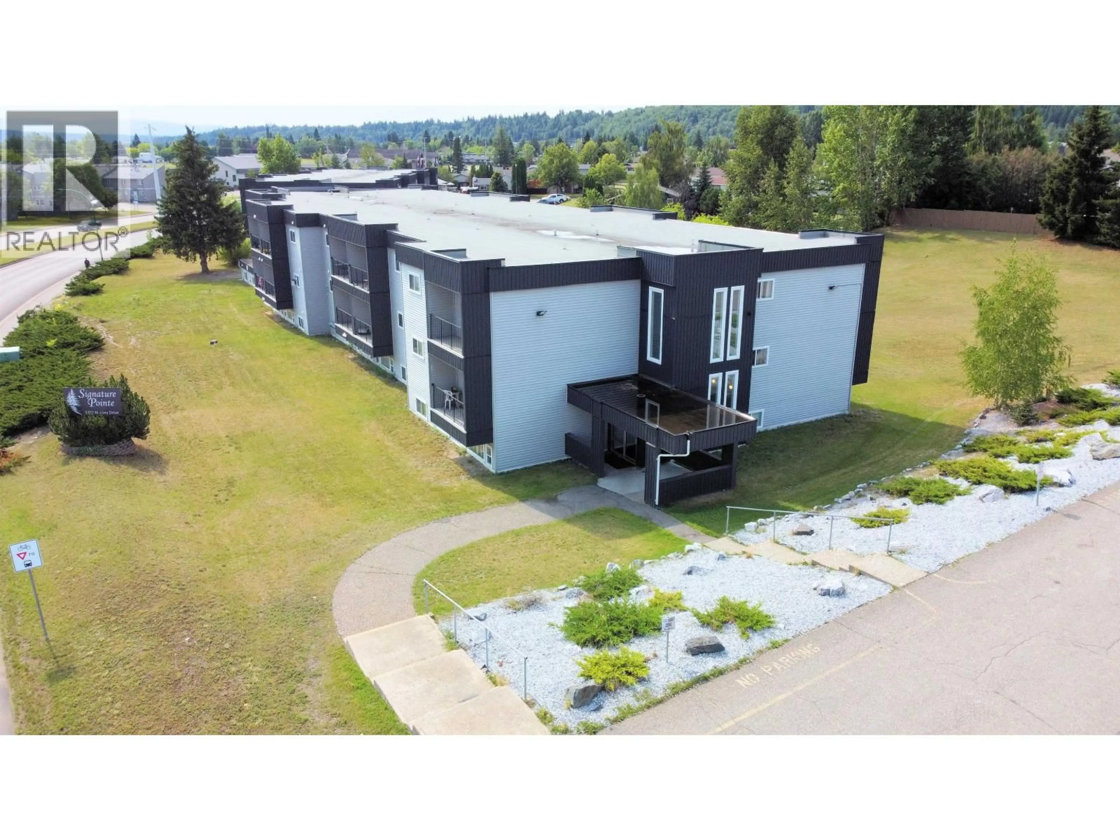 A pic from outside/outdoor area/front of a property/back of a property/a pic from drone, building for 106 - 3777 MASSEY DRIVE, Prince George British Columbia V2N4J6