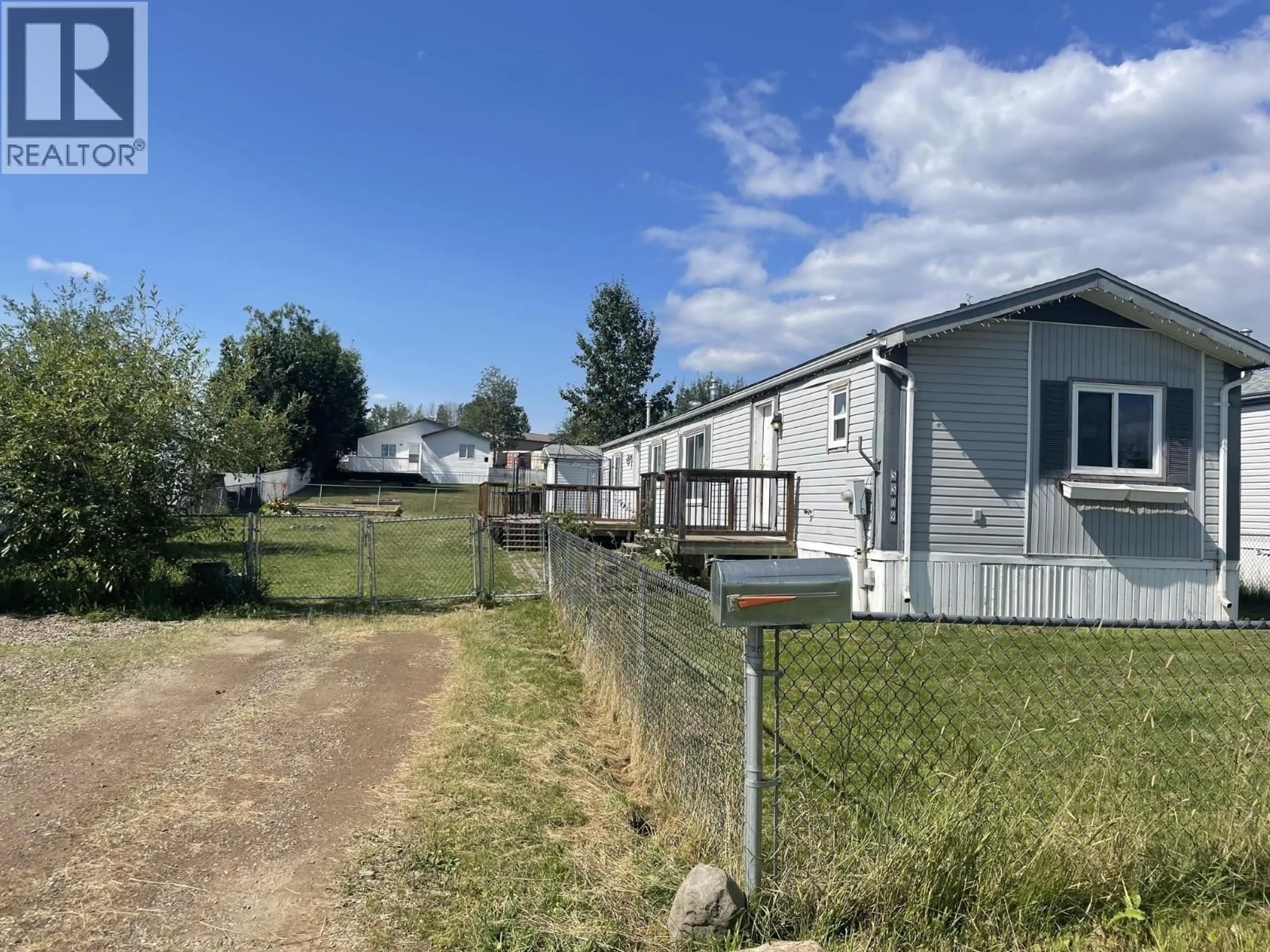 A pic from outside/outdoor area/front of a property/back of a property/a pic from drone, street for 5509 42 STREET, Fort Nelson British Columbia V0C1R0