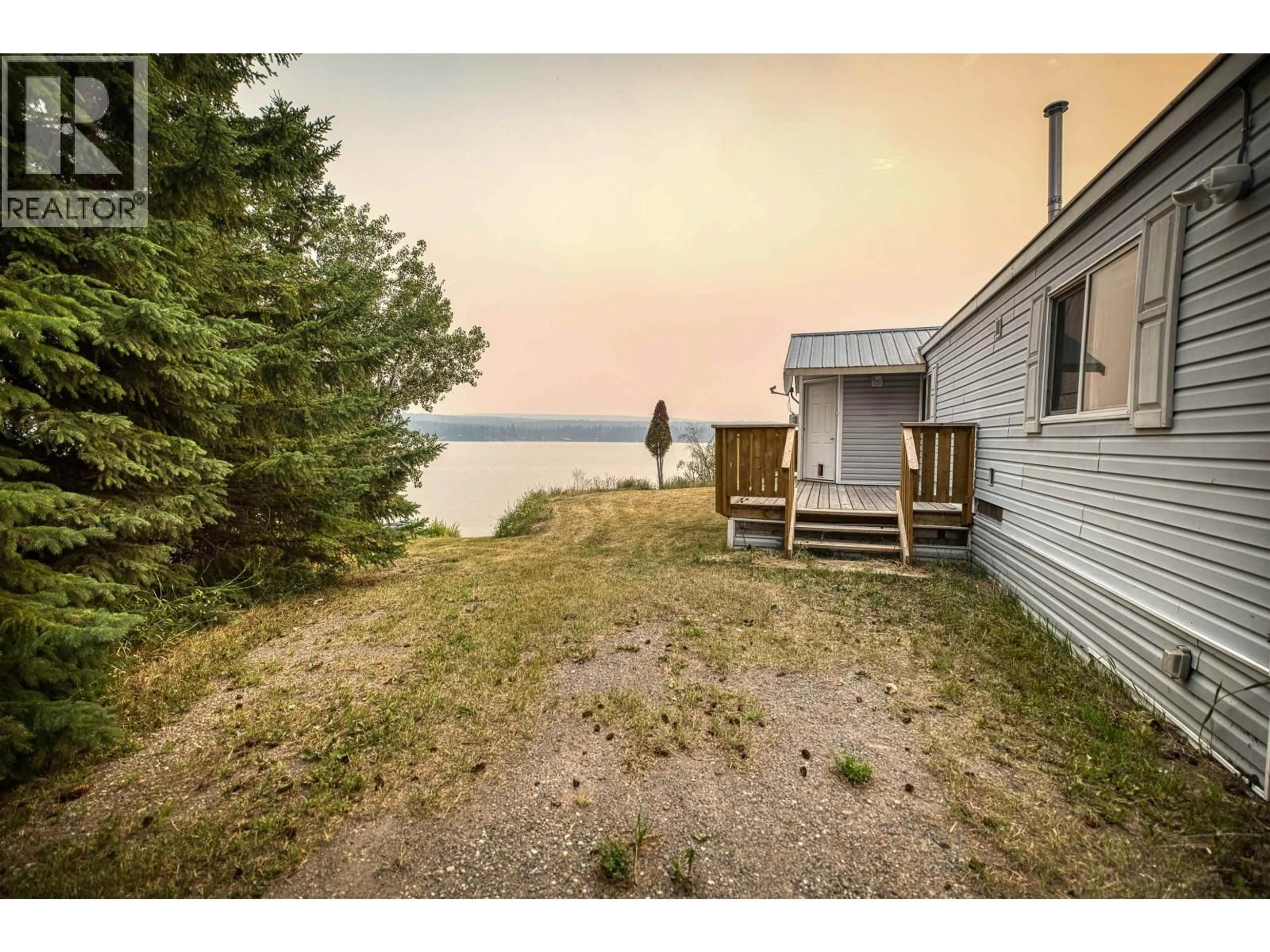 A pic from outside/outdoor area/front of a property/back of a property/a pic from drone, water/lake/river/ocean view for 4078 MCKINLEY DRIVE, Lac La Hache British Columbia V0K1T0