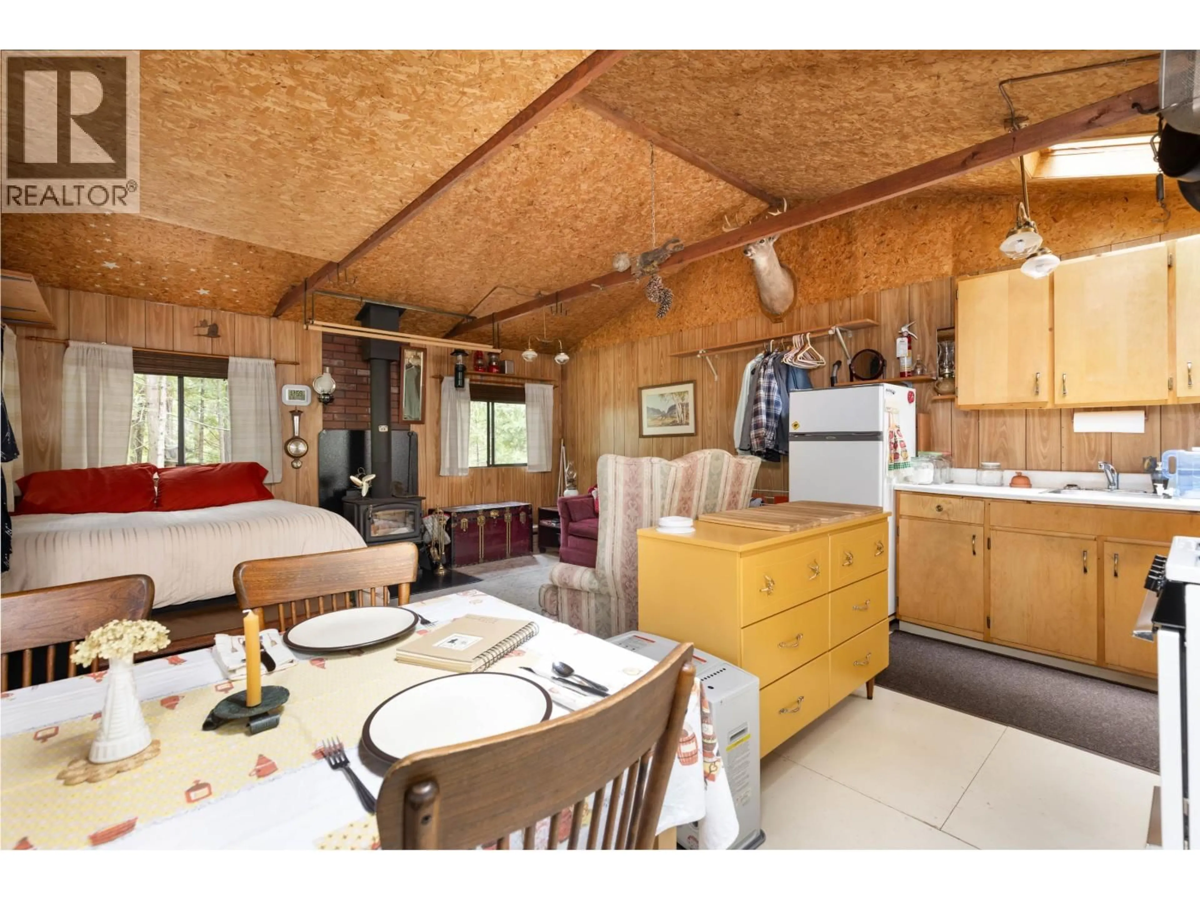 Open concept kitchen, wood/laminate floor for 9540 PEMBERTON PORTAGE ROAD, Pemberton British Columbia V0N2L1