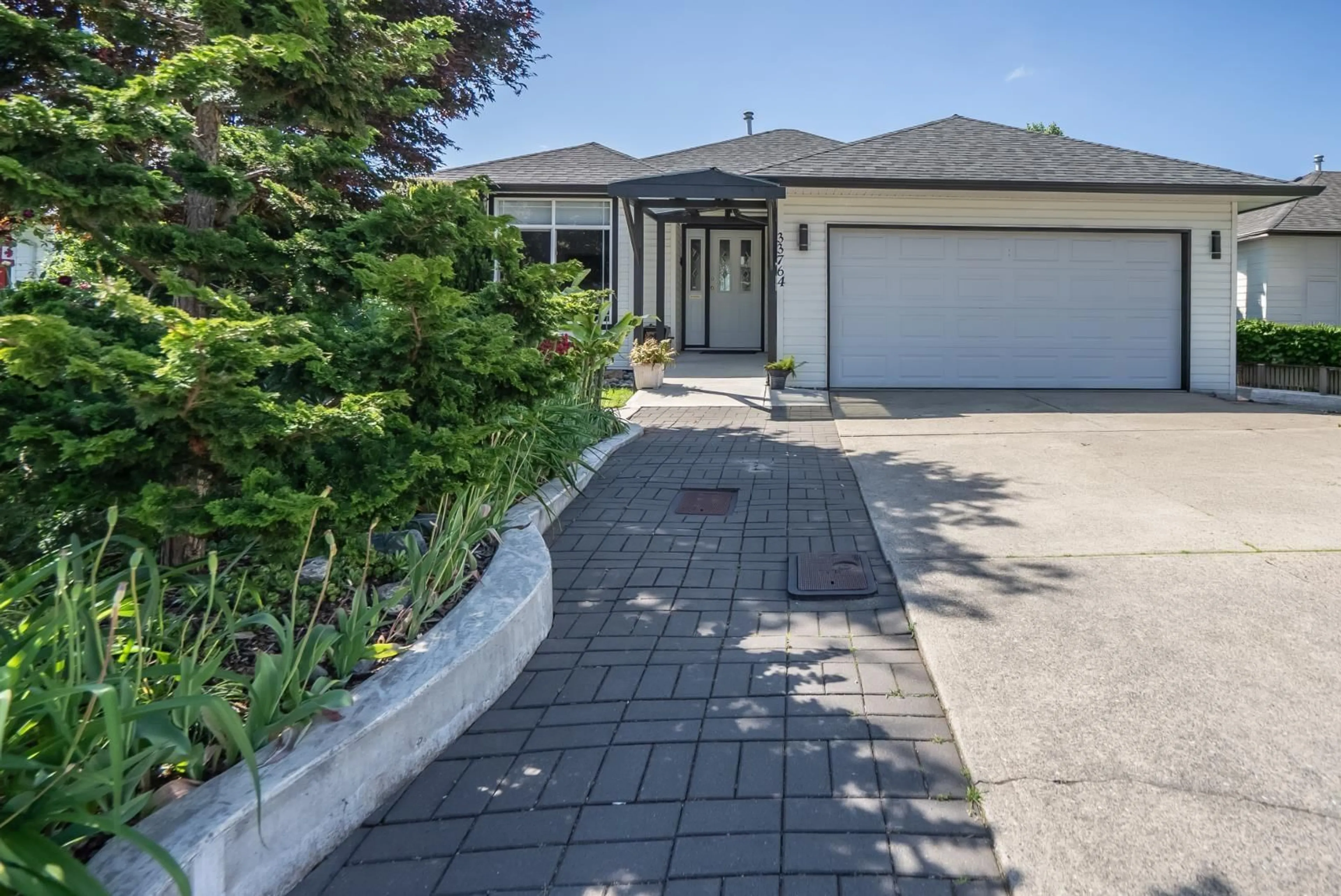 A pic from outside/outdoor area/front of a property/back of a property/a pic from drone, street for 33764 BLUEBERRY DRIVE, Mission British Columbia V2V7A1