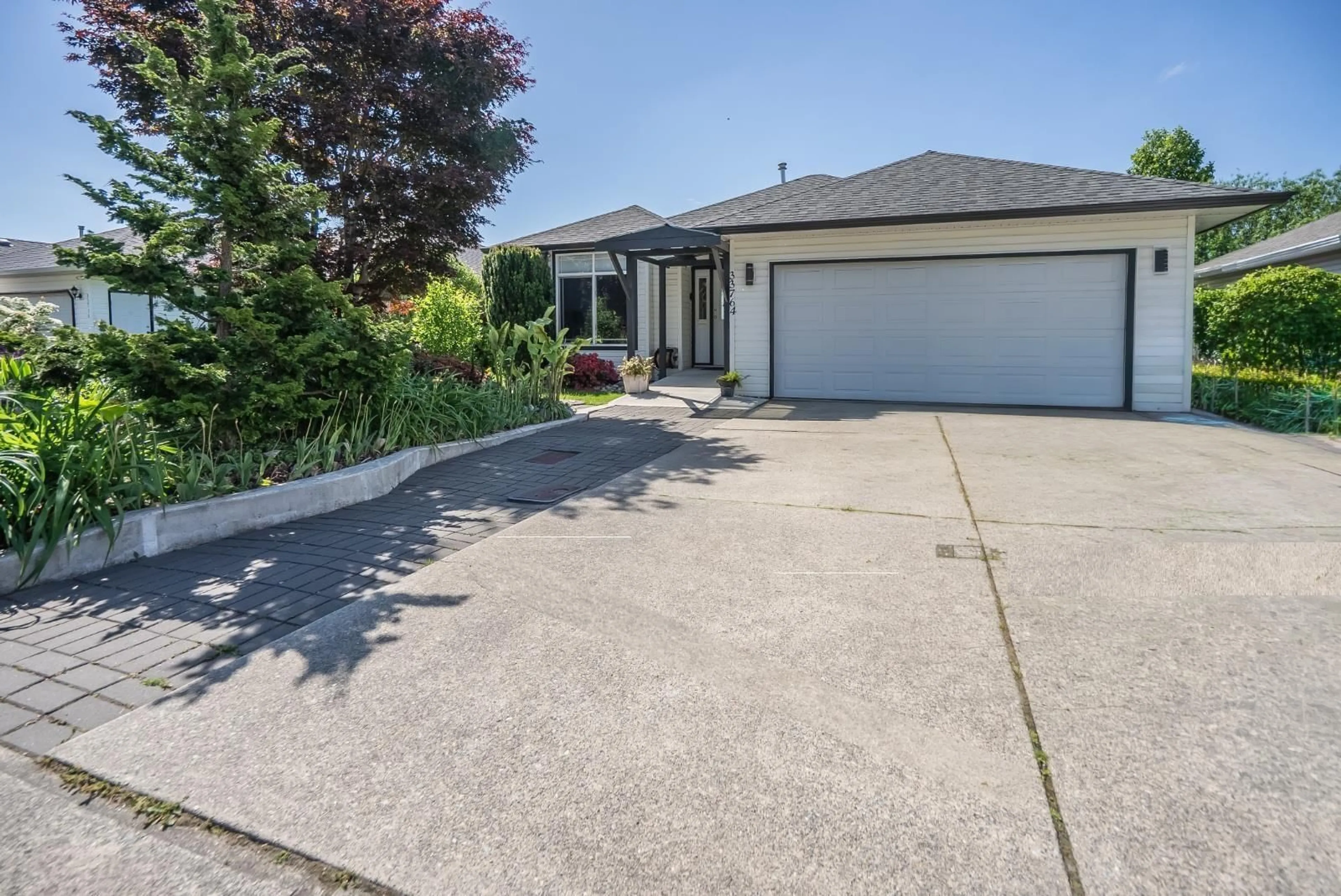 A pic from outside/outdoor area/front of a property/back of a property/a pic from drone, street for 33764 BLUEBERRY DRIVE, Mission British Columbia V2V7A1