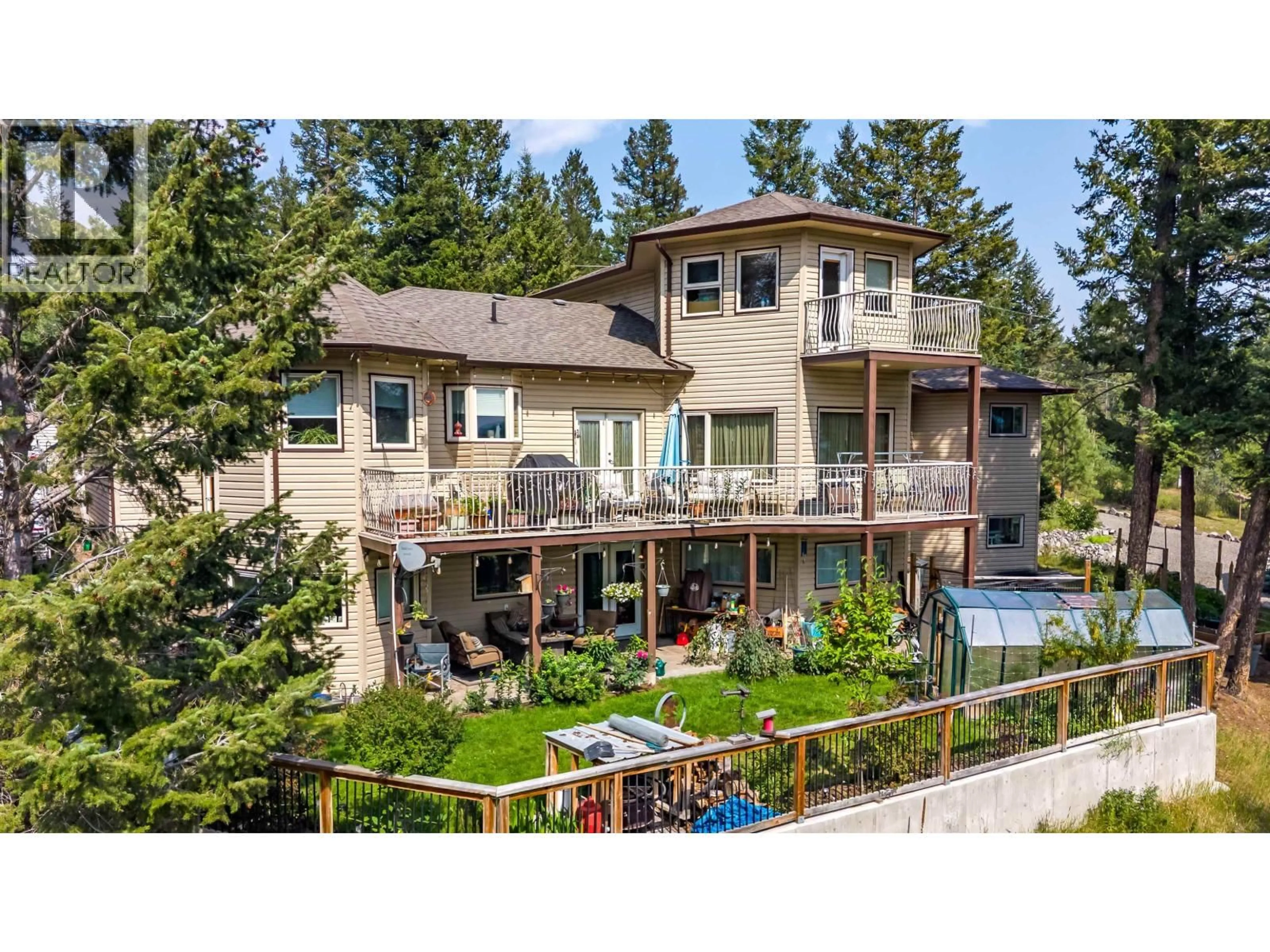 A pic from outside/outdoor area/front of a property/back of a property/a pic from drone, unknown for 4882 GLOINNZUN CRESCENT, 108 Mile Ranch British Columbia V0K2Z0