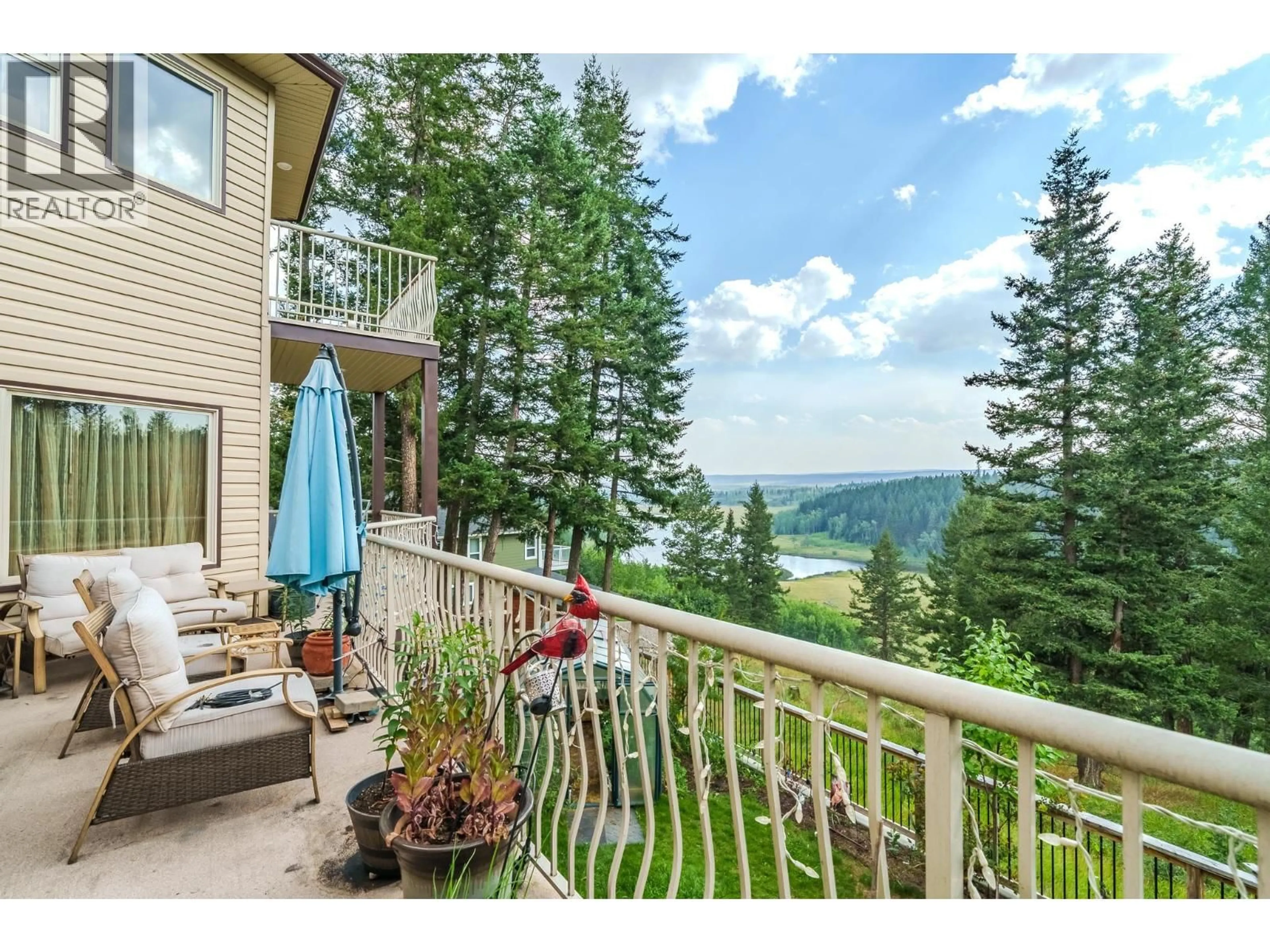 Patio, water/lake/river/ocean view for 4882 GLOINNZUN CRESCENT, 108 Mile Ranch British Columbia V0K2Z0