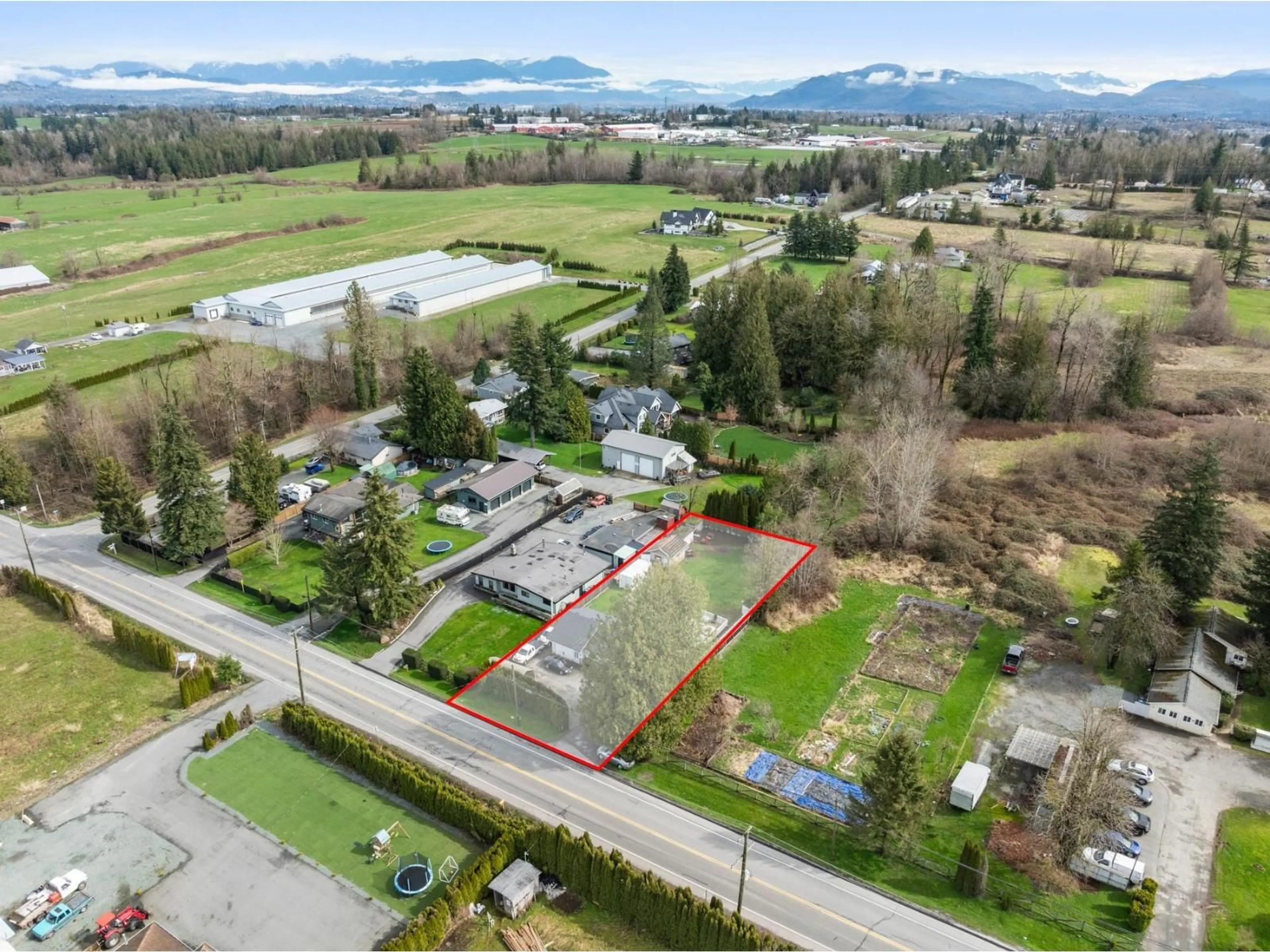 A pic from outside/outdoor area/front of a property/back of a property/a pic from drone, street for 3132 BRADNER ROAD, Abbotsford British Columbia V4X1K2