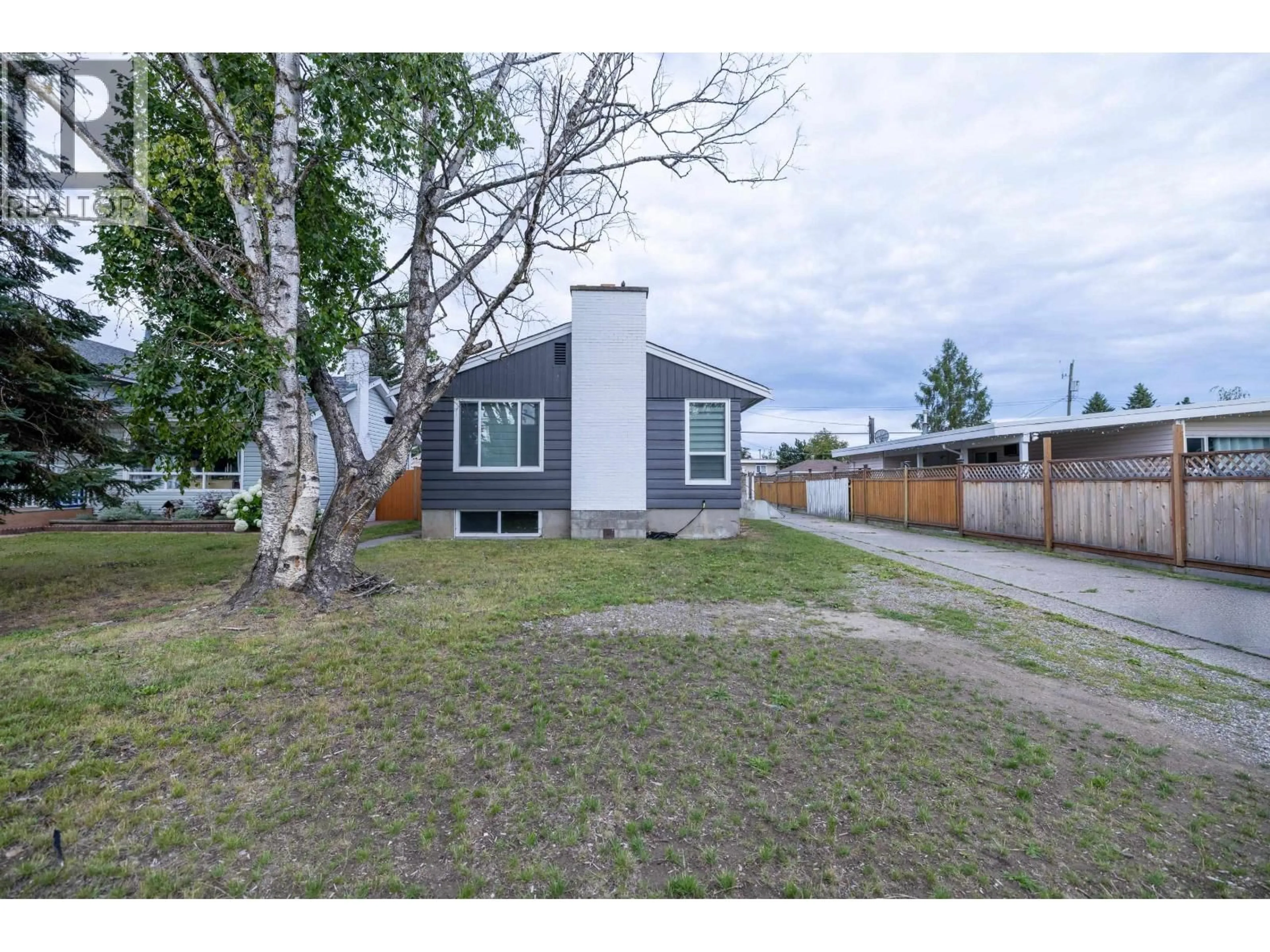 A pic from outside/outdoor area/front of a property/back of a property/a pic from drone, street for 242 LYON STREET, Prince George British Columbia V2M3K8